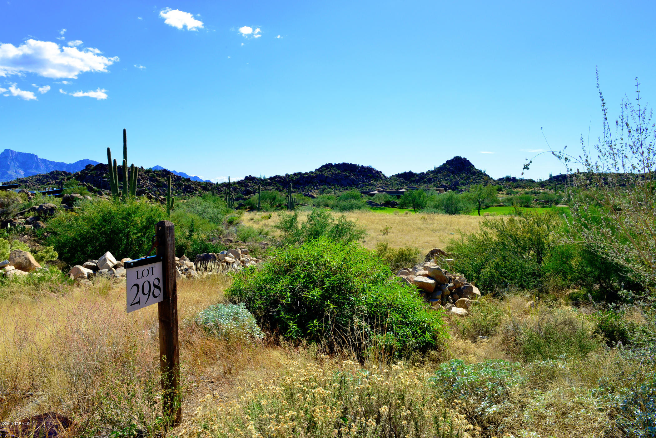 Stunning panoramic views of 7th fairway of Phil Mickelson's Stone Canyon Club.  Easy-build site in elevated location offers fabulous vistas of Catalina Mountains to the east, golf course to the south and the rugged Tortolita Mountains to the north. Stone Canyon is a private guard-gated luxury residential golf community ranked #33 in Golfweek's Top 100 Residential Golf Courses for 2015 (course designed by Jay Morrish).