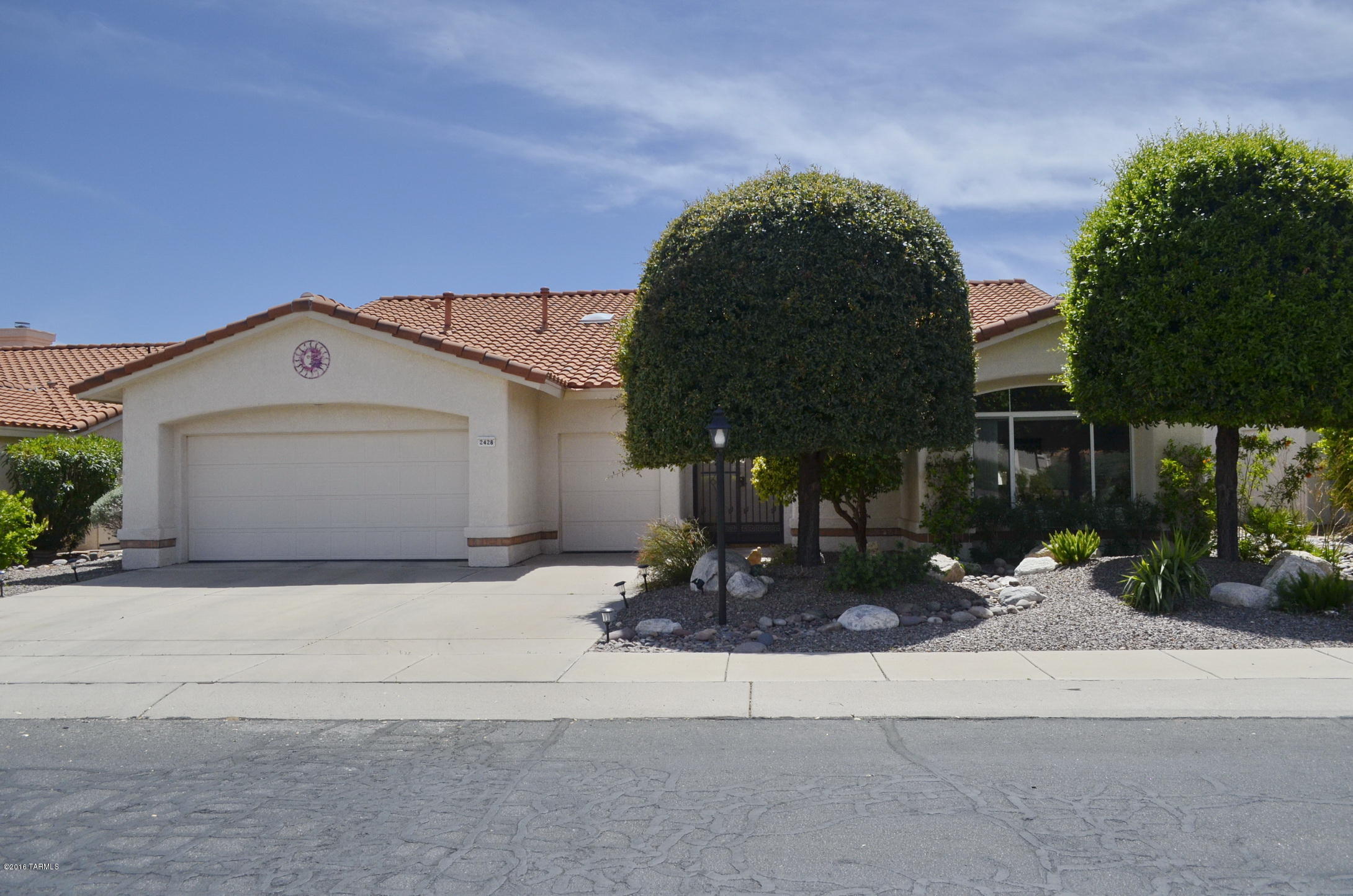 Enjoy Sun City Vistoso's active adult community in a 3BD 2,630 sqft. The spacious floor plan is very desirable with a formal dining room/living room combination, large bay windows, family room, dual sided fireplace, island kitchen with granite counters and a multi-purpose room. This Del Webb home has two large master bedrooms with their own bathroom and a third bedroom w/ a double door entrance. The master bath includes two sinks, large soaking tub, shower & walk in closet. There is no shortage of storage in the 2 car garage with additional golf cart space. Appreciate the backyard oasis with Catalina mountain views, extended brick paved patio and mature landscaping.