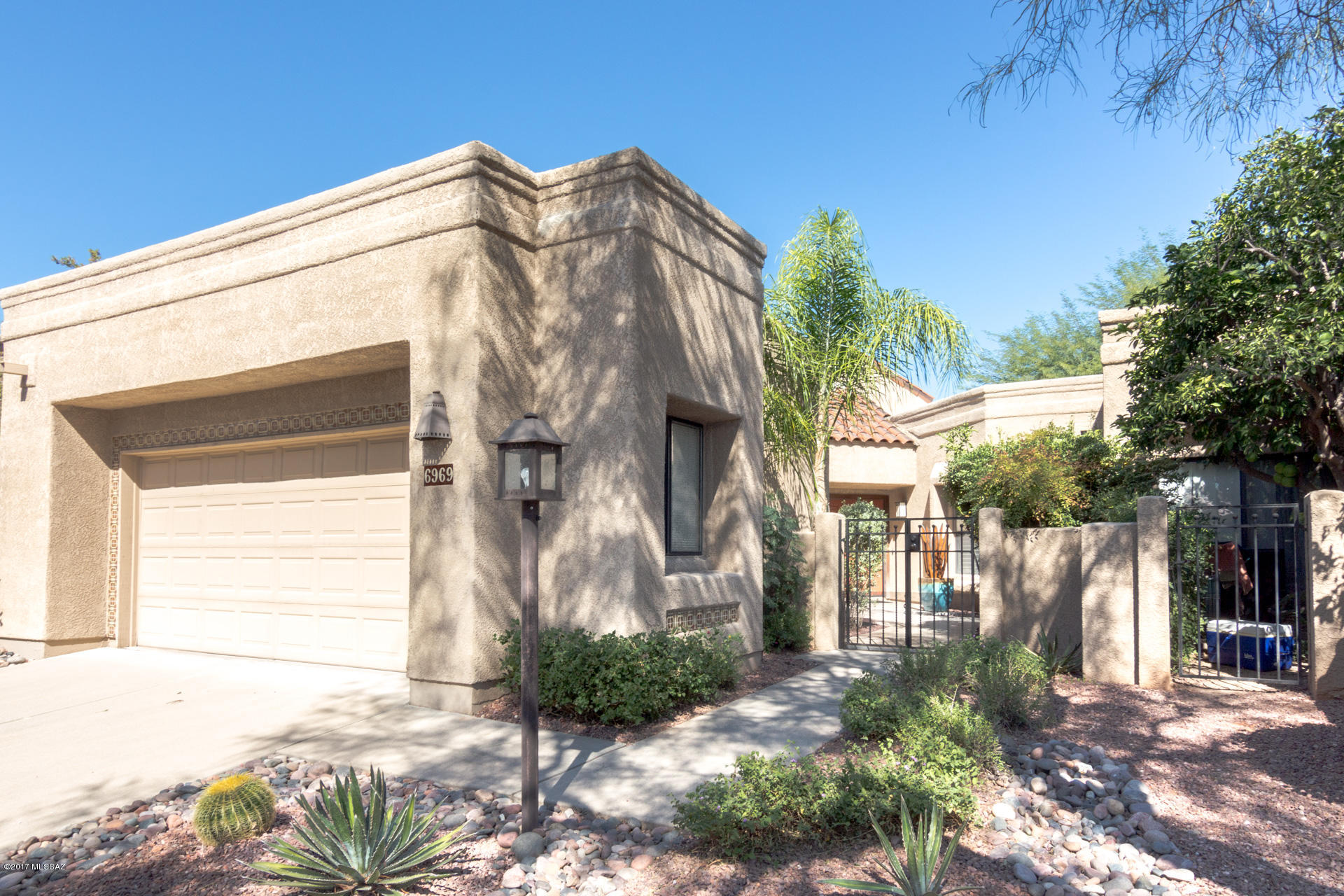 Completely remodeled Golf Villa in prestigious gated Ventana Canyon Country Club. Mountain & Golf Course views from private patio. New travertine floors, kitchen cabinets, SS appliances, quartz tops, bathrooms, doors and trims. Copper pipes no poly and new roof. Vaulted ceilings with stacked stone fireplace. Light & bright interior. Walking distance to heated community pool, Country Club for dining, swimming, tennis, pickleball & golf. Close to shopping, dining and Sabino Canyon Rec area for hiking and mountain exploring. Come live the Resort lifestyle in Ventana Canyon Country Club.