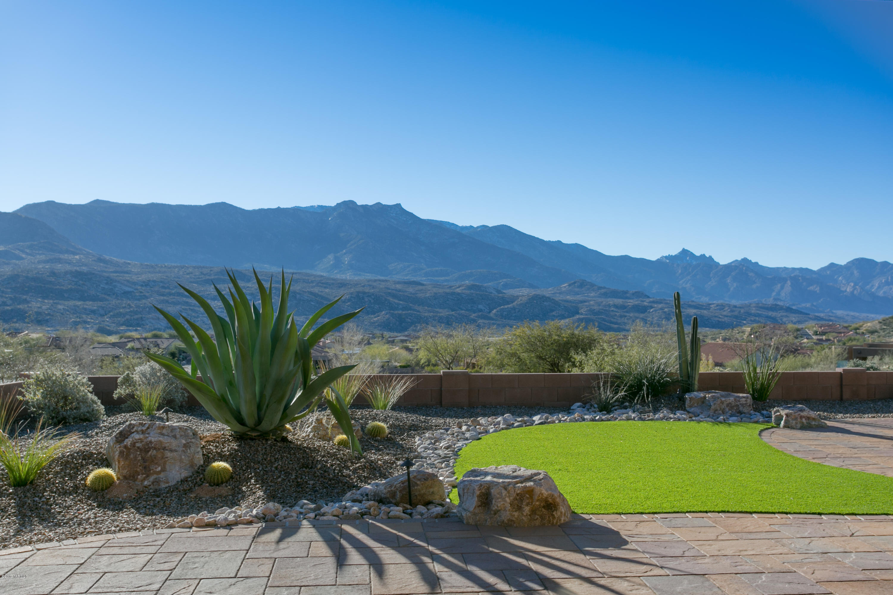 Stunning Canyon model overlooking the Catalina Mountains and holes 10, 11 & 12 of the Preserve Golf Course in SaddleBrooke. This home has numerous builder upgrades. This highly sought after floor plan is your perfect entertaining home with a large quartz island in the central kitchen adjoining the open and spacious great room and dining room. A wall of windows stretching the length of the house looks out to the golf course and spectacular mountain views. Split bedrooms with a large master bedroom and ensuite and two additional bedrooms plus office/den. This home also has a four car garage with space you can use as a workshop. This is a must see home on one of the most spectacular lots in the prestigious Preserve at SaddleBrooke.The hot tub does not convey.