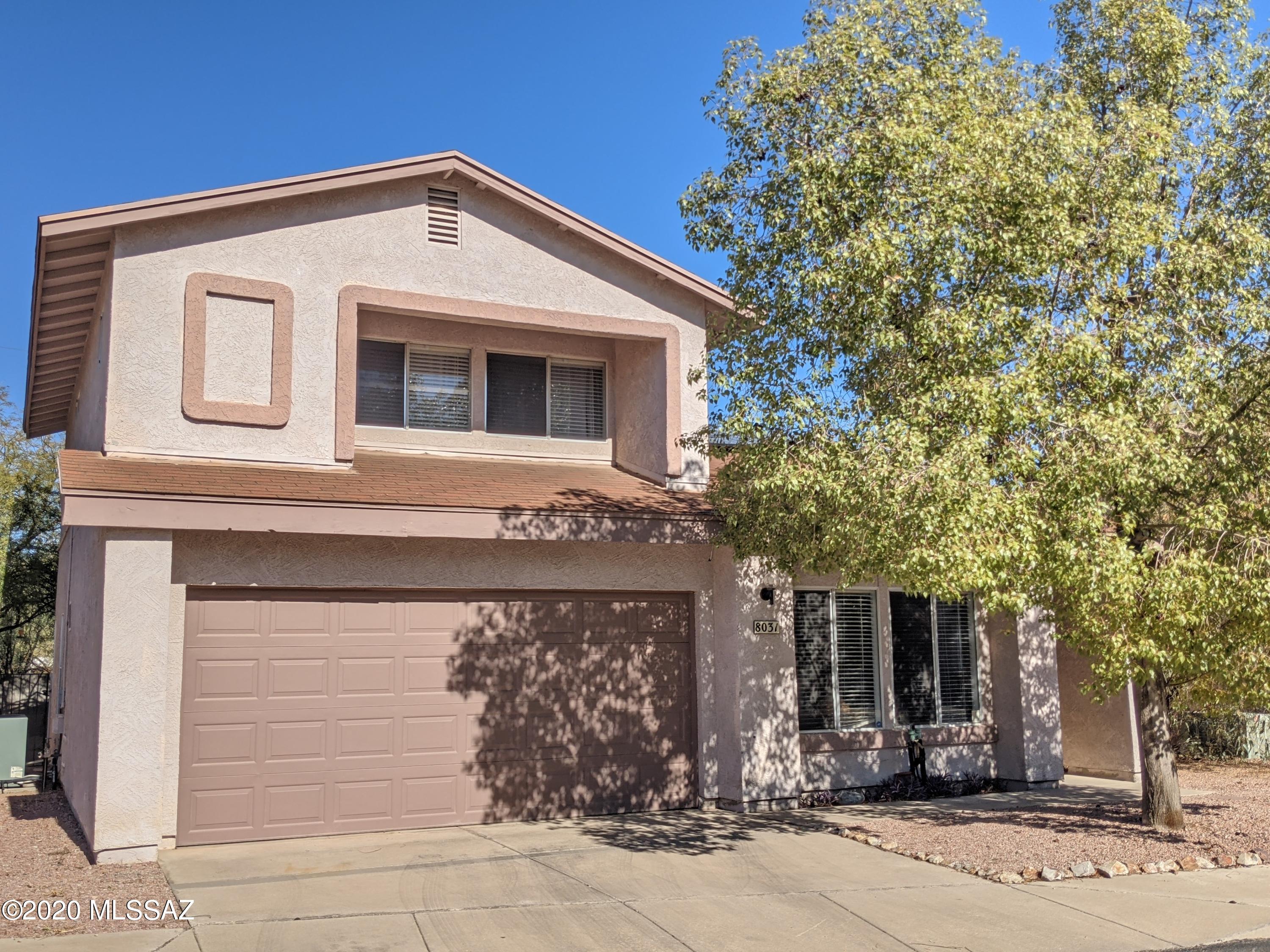 Fantastic home w/vaulted ceilings, soothing palette, ceiling fans, window blinds, & plush carpet. Formal dining area w/patio access. Handsome barn door entry into the eat-in kitchen w/a neutral tile floor, stylish kitchen counters, SS/black appliances, pantry, & plethora of white cabinets w/hardware.  Patio access from breakfast area. Generous sized bedrooms, gorgeous remodeled baths w/designer tile, mirror, & vanity, ample closets,  & garage laundry area. Spacious paver patio, shade trees, & room for a pool! Borders the natural desert. Community Pool.  Nearby Shopping, Dining  & more.  Home has owned Solar and no poly pipes! And a 2 year old water heater.