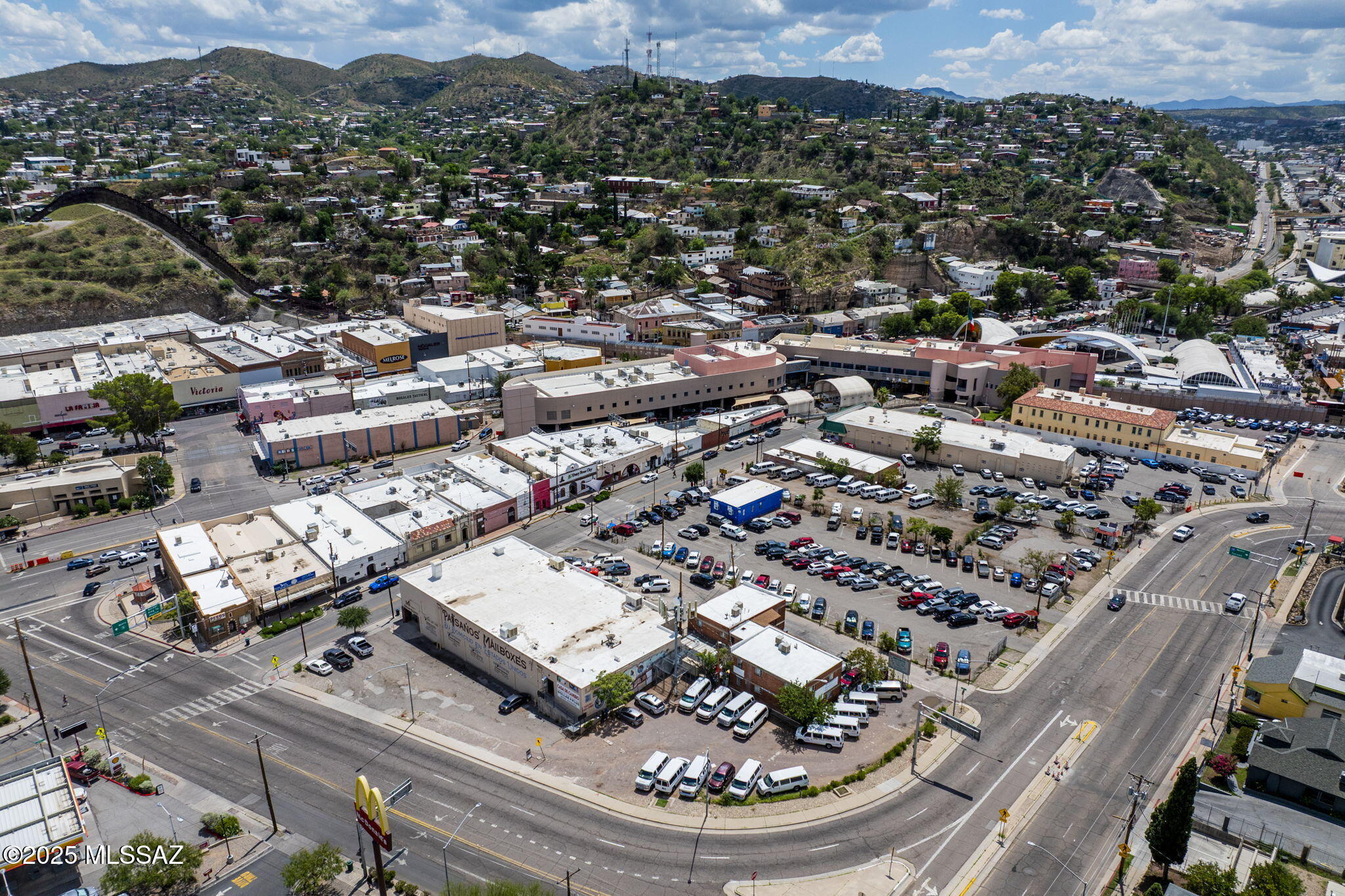 Presenting the Larriva Downtown Nogales Commercial Block- an exceptional opportunity to acquire a prime +/- 1.716-acre commercial property encompassing 13 contiguous parcels. Ideally situated in the heart of downtown Nogales, Arizona - just a few steps north of the U.S.-Mexico border/Dennis DeConcini Port of Entry- this portfolio represents a rare and highly sought-after acquisition.

The offering includes a diverse mix of income-generating assets including a +/- 20,482 square foot big-box retail building, approximately 155 paid parking spaces, a four-unit office/apartment  complex, multiple ATM installations, and a cellular infrastructure tower. Positioned at a high-visibility intersection within the city's historic downtown corridor, the property benefits from strong border proximity, supporting trade, logistics, and cross-border commerce.

Anchored by established long-term tenants with consistent rental income, the block also presents compelling upside potential through redevelopment or re-tenanting of underutilized parcels. With both immediate cash flow and long-term value appreciation, this investment offers a unique opportunity to secure a cornerstone position in one of the region's most critical logistics and border commerce hubs.
