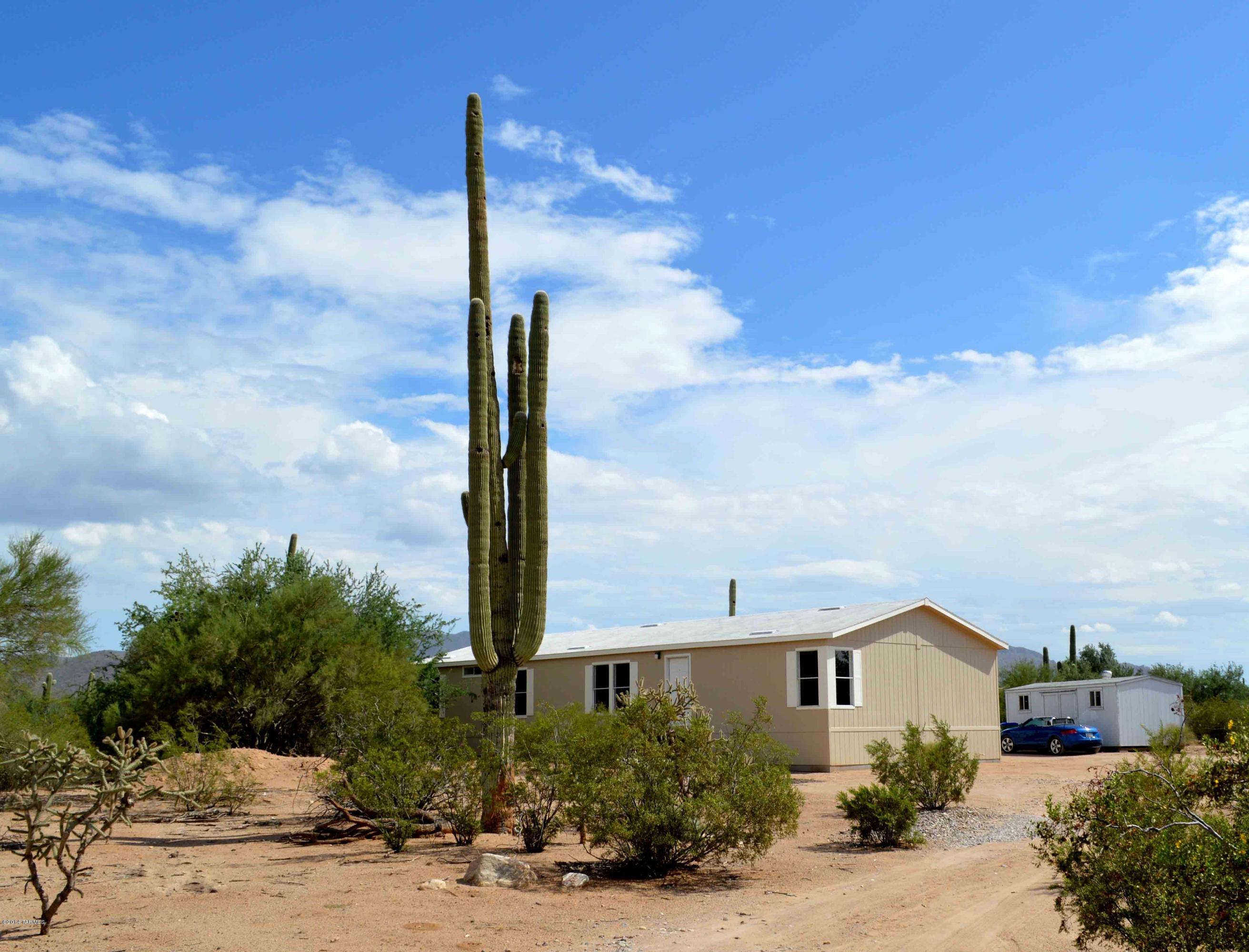 EXCELLENT 4.15 AC HORSE PROPERTY!! This well vegetated not too far off paved road that includes HUGE partially enclosed screened in garden to grow lots of your own food! Or set-up for horses. MARVELOUS Mountain & Sunset VIEWS!!
Inside boasts split bedroom plan, separate family room with fireplace, extra large master bedroom, spacious kitchen, living room and dining area. NO HOA!