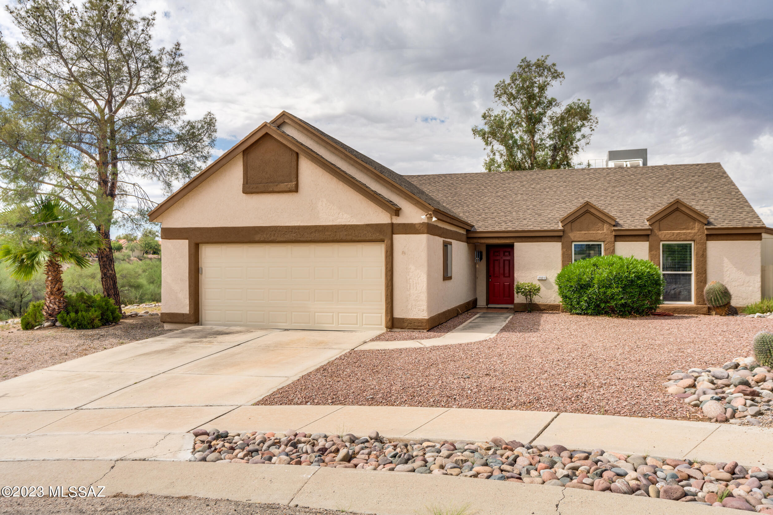 Beautiful 3 bed/2 bath home in the desirable Saddlewood Ranch Neighborhood on a large corner lot of a cul-de-sac with NO HOA! Large lot, 2 y/o HVAC, 1 y/o Garage Door. Kitchen boasts tall cabinets, granite countertops,  breakfast bar & nook with bay window.  Living room has wrap around shelving and wood burning fireplace for those comfy nights.  Main bedroom has 2 walk-in closets and the Panasonic mounted 19'' TV stays.  Mud room and extra storage room provides lot of space for extras, or use as a artist's room or workroom for your hobbies!  This home is 10 minutes from the U of A, 5 minutes from Pima West Campus, 5 minutes from I-10 & close to shopping!  Large backyard to transform into your paradise!  Won't last!  Seller will provide 5,000 carpet allowance w/full price offer