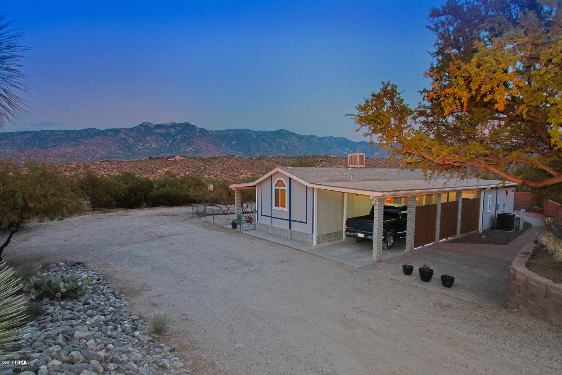 Stunning mountain views! This completely updated, Great Room concept home has 2 Bedrooms + Den/Bonus Room & 2 1/2 Bathrooms in the Main House, 1 Studio w/ Separate Entry & it's own 3/4 Bath, all tiled throughout, & a Workshop/Work-Out/Man Cave separate from the rest of the home! Everyone can enjoy their own space when they are not enjoying Mountain Views from the Outdoor Living Space of the 60 ft. brick Covered Patio. This is a meticulously maintained property w/tons of space is warm & inviting & ready to move in! Come See!