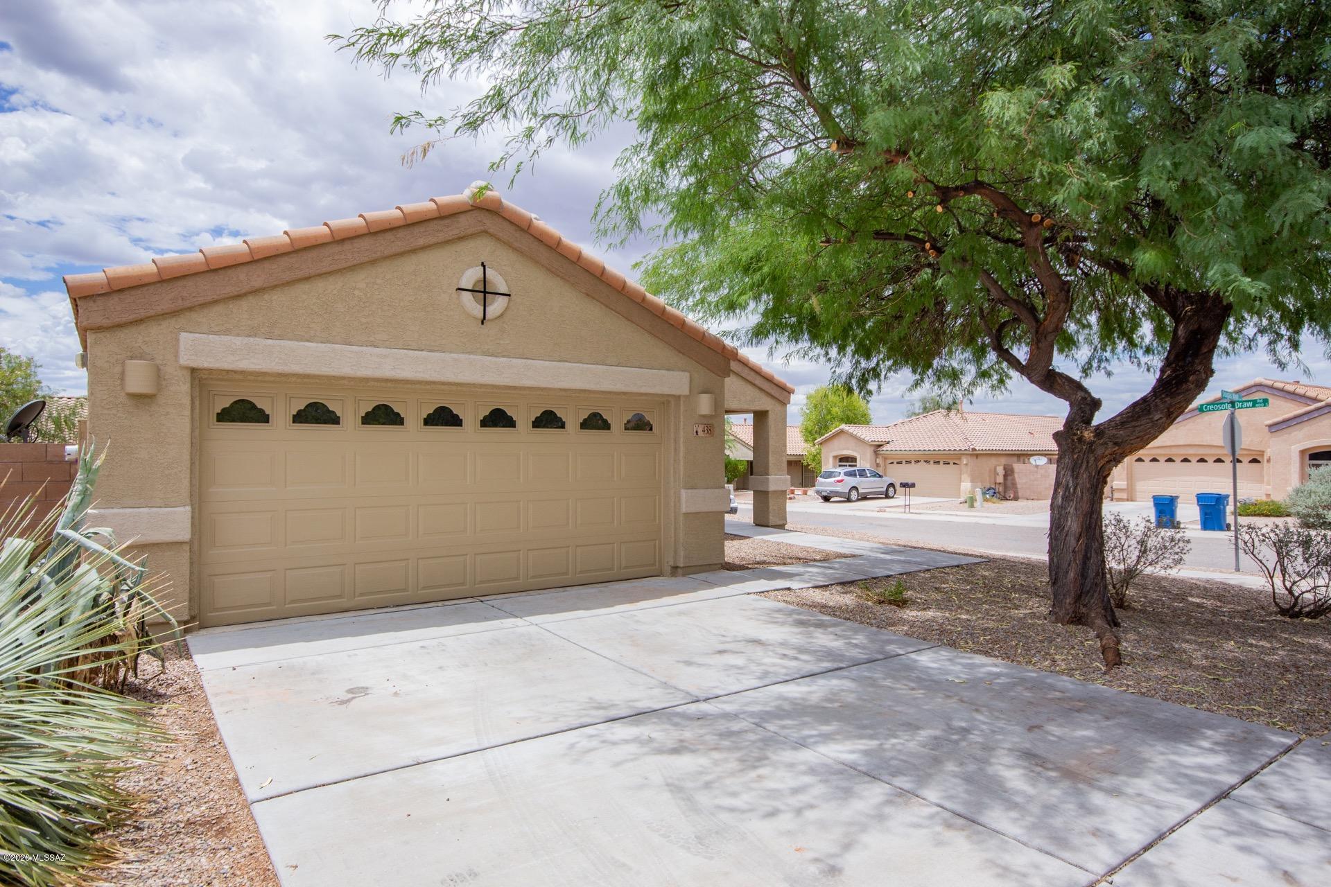 Fantastic Home situated on a corner lot in the desirable Community of Oasis Santa Rita. Spacious open floor plan, plush carpet, ceiling fans, soaring ceilings, beautiful tiled floors, & patio access from great room. Formal dining area, corian kitchen counters, under-mount sink, pantry, window blinds, & plenty of wood cabinets.  3 Generous sized bedrooms, ample closets, 2 upscale baths w/corian counters, & interior laundry closet for your convenience.  Private en suite in master bedroom w/a vaulted ceiling & walk-in closet. Enjoy the backyard covered patio, decorative stone, & patio for dining. Add a pool or garden w/colorful plants!  Will not last!