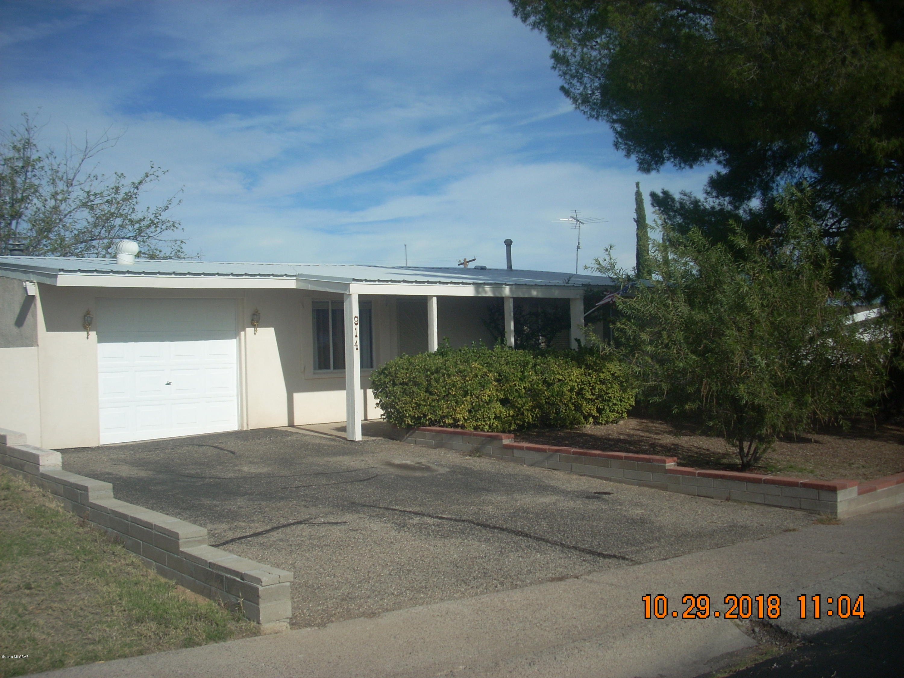 This home has been well cared for.  Metal roof, stucco exterior, retaining wall with easy maintenance front yard, A/C. Remodeled kitchen and bath. Ceramic tile and carpet flooring.  Garage/workshop. Fireplace. Storage shed. Backs to desert.