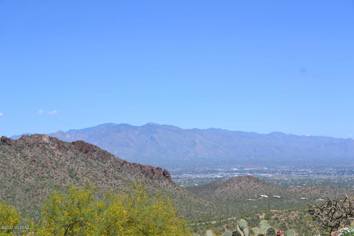 Breathtaking panoramic views! This 3.15 acre lot is situated on a hill that overlooks the beautiful desert scenery. Located in the gated community of Trails End Estates and nestled in the studded hills surrounded by luxurious estates! Easy commute to downtown, U of A, and local shops & restaurants. Come by and see the amazing views in person!