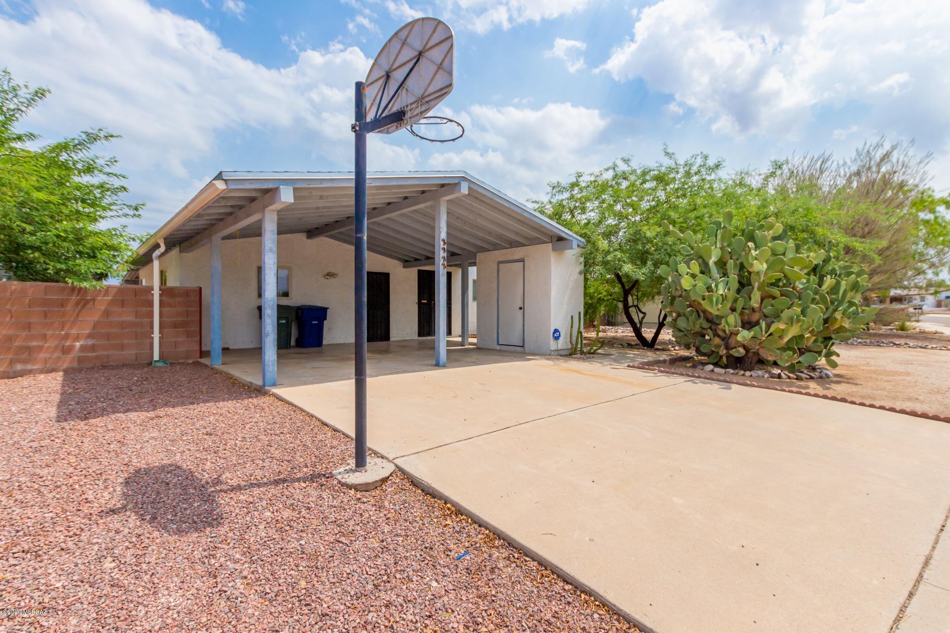 Charming home situated on a large lot w/a sparkling fenced pool, covered patio, & fire pit area.  Welcoming palette, tiled floors, ceiling fans, French door to patio, & plenty of natural light. Center kitchen island, breakfast bar, stylish counters, & wood cabinets. Laminate wood floors in all bedrooms, 2 pristine baths, ample closets, & pet door. Nearby Lakeside Lake Park. Perfect starter home! NO HOA!