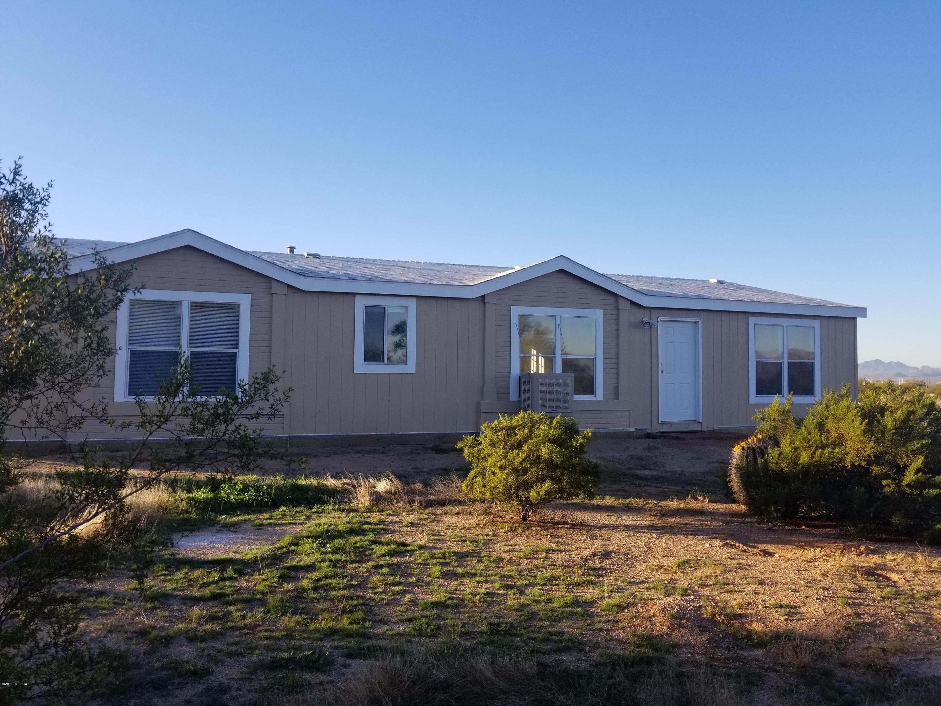 Mountain views, quiet sunsets, and privacy, if these are for you, then this is the property!! This freshly painted manufactured home sits on 4 acres with panoramic views! This home has lots of extras, ceiling fans, fireplace in great room, tape & textured walls w/ rounded corners, and very open floor plan. Large kitchen with walk in pantry and ceramic tile. ALL appliances stay!!! Lots of room to ride, hike, and/or star gaze!!!