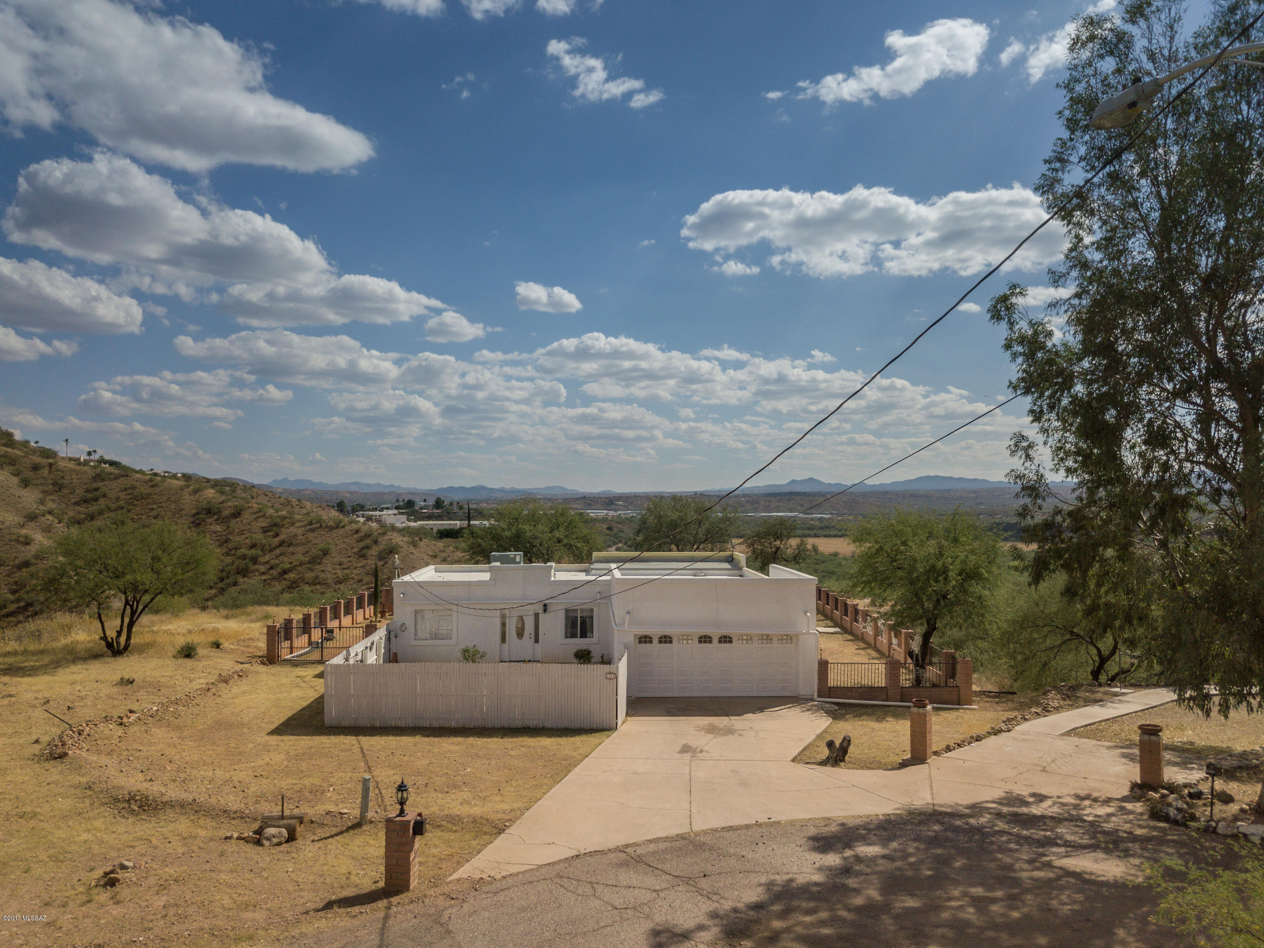 Beautiful home located in desirable Rio Rico location. Spacious natural desert surrounding the home, breathtaking 360 degree views around the home. This 3 bedroom, 2 bathroom home is very cozy, and welcoming. The bathrooms are remodeled and darling. Easy access to freeway! This home is perfect for families. Call and schedule a showing today!