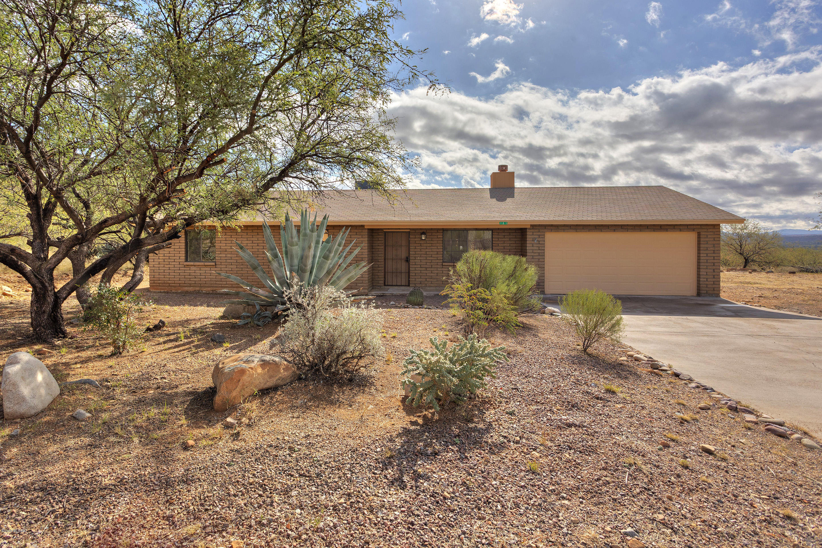 Exceptional home located on premier lot in coveted Rio Rico! This renovated property features soaring vaulted ceilings, saltillo tile, new interior/exterior paint, refinished cabinets, new heat pump, laundry room, water softener system, spacious two car garage, walk in closet, and new carpets! Exterior features established vegetation, gated back yard, fountain feature, saltillo patio area, and remarkable views of the San Cayetano Mountain/Santa Cruz County Valley!