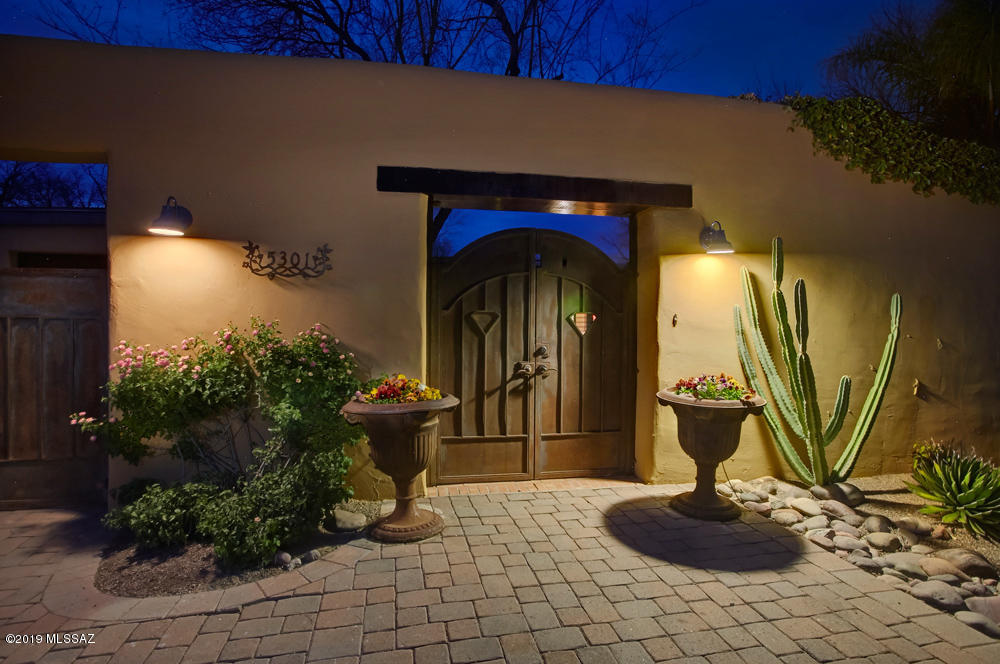 A perfect balance of modern contemporary design blends seamlessly w/the authenticity & character of a mud adobe Hacienda in one of Tucson's most coveted communities, The Old Fort Lowell Historic District. Remodeled by McCaleb Construction the significant redesign of this home is of the highest quality & craftsmanship & is evidenced in the finishes throughout. The striking kitchen features Caesar stone counters, custom cabinetry, Wolf & SubZero appliances. Concrete floors & high beamed ceilings accentuate the open floorplan featuring a large master w/designer bthrm. 2 guest suites are accessed off the courtyard for a true Hacienda experience. Black bottom pool, tasteful landscaping & vine covered walls create an ambiance reminiscent of San Miguel de Allende. Two car garage w/private gates.