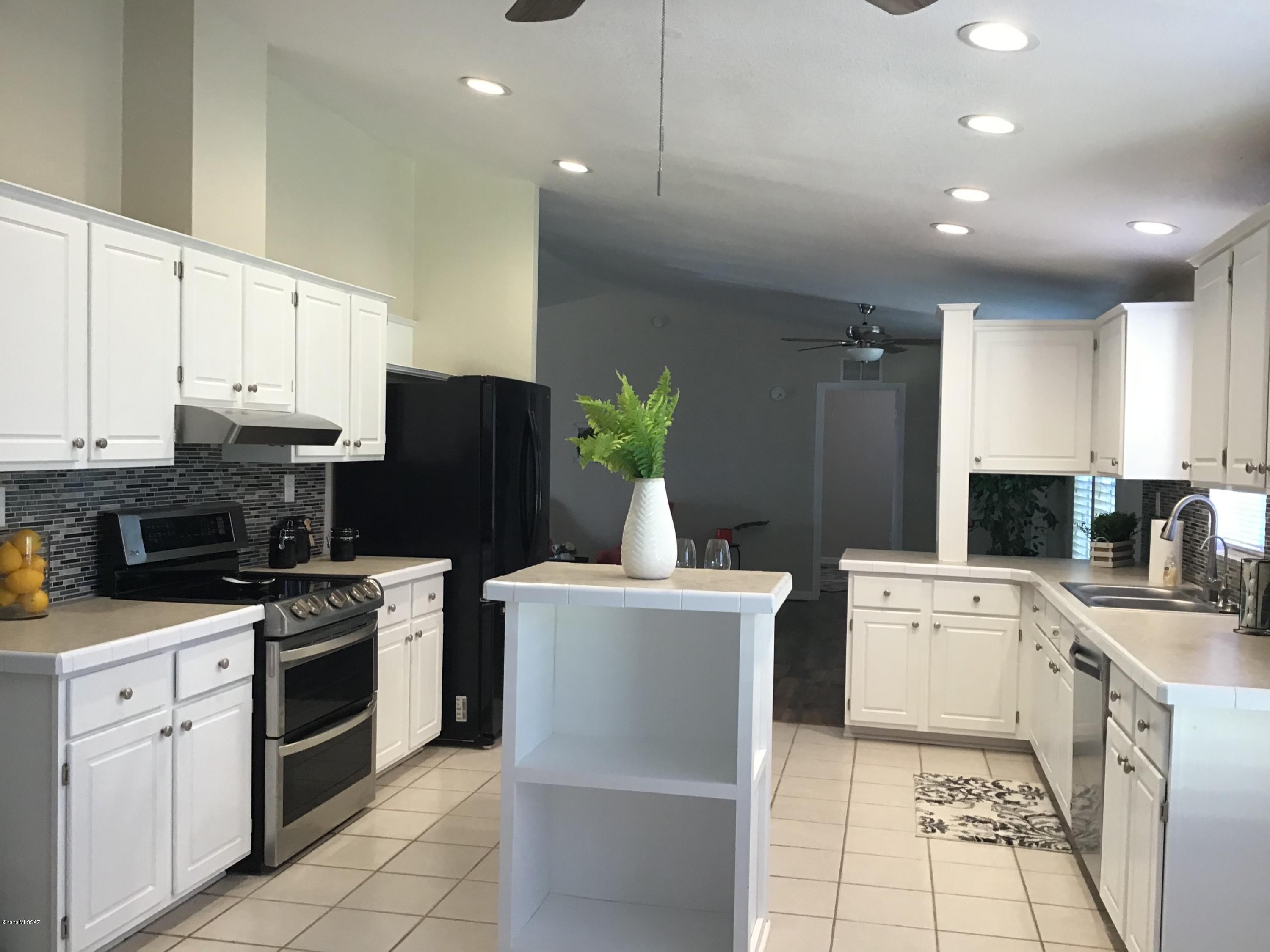 Private oasis with lots of trees and charm. Remodeled throughout, giving this 3 bdrm home a fresh look with a great open floor plan, covered decks on 3 sides, fruit trees and workshop, circular drive w/2 entrance gates, and butts up to state land. Features a large kitchen w/lots of updated kitchen cabinets and appliances. Walk in pantry and eat in kitchen plus a dining room. Separate laundry room with plenty of room for another fridge or freezer. New custom paint and baseboards, ceiling fans throughout, garden tub and walk in closet in the master bedroom. Cozy wood burning fireplace in living room. Bring your RV, toys or horses, Butts up to State land. Lot next door is also available if you need more space, giving you 2 full  acres. See agent remarks