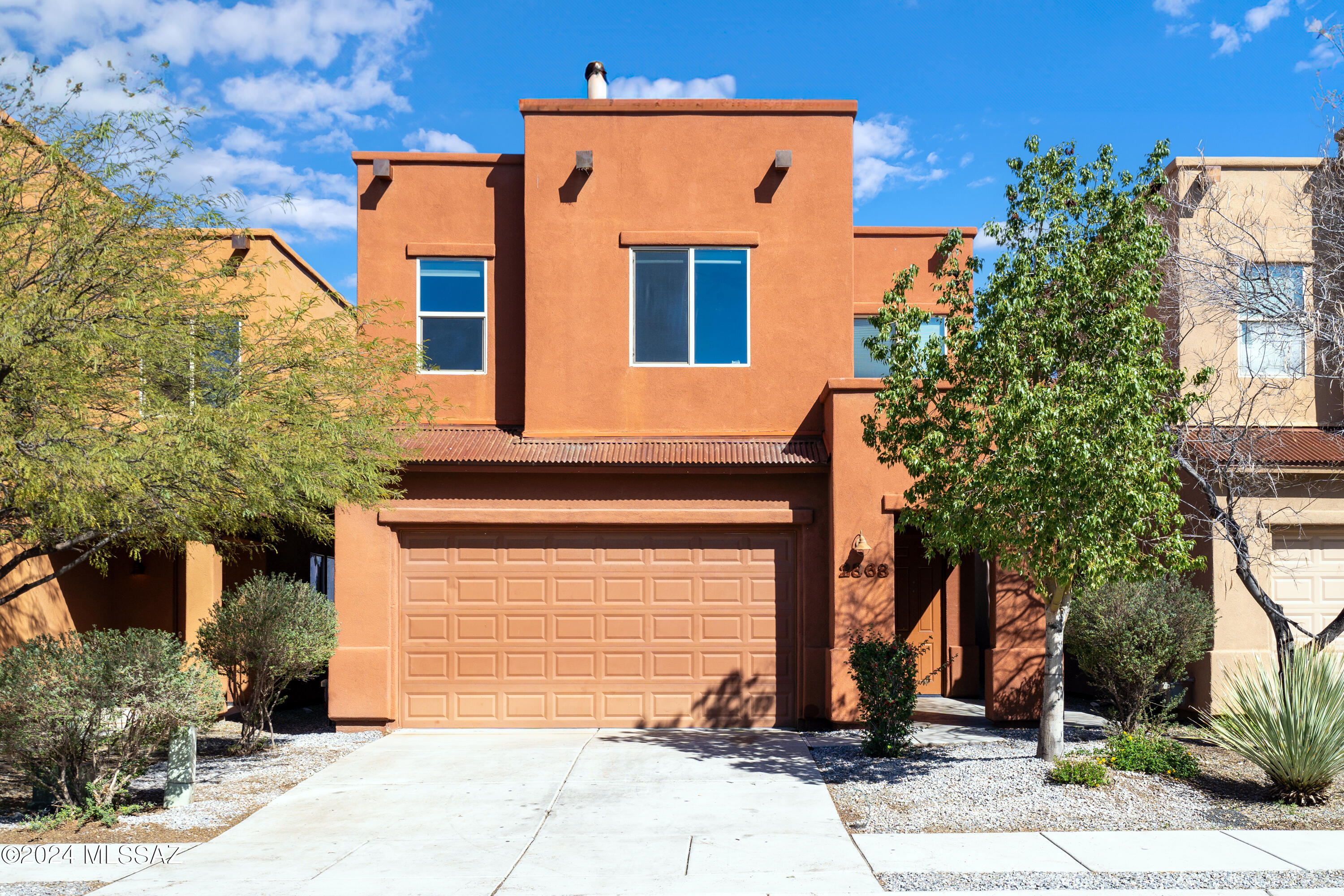 Welcome to this stunning Miramonte home built in 2015! This spacious residence boasts 4 bedrooms and 3 bathrooms. Recently remodeled second-story bathrooms feature beautiful shower installations. Enjoy the fresh look of new flooring and interior paint throughout. Outside, the low-maintenance backyard features turf and newly rocked areas with picturesque mountain views. Conveniently located near the University of Arizona, Banner Hospital, shopping, and dining options. Your new home awaits!