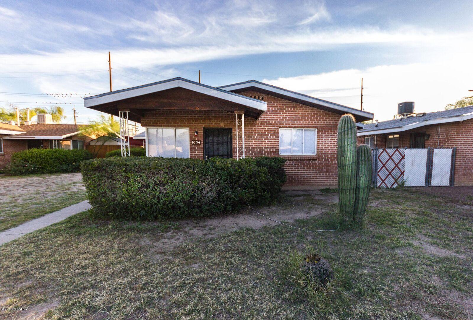 Solid masonry duplex within 1.25 miles of U of A!  Both units have 2 bedrooms, 1 bathroom and rent for $750 each side.  Live in one side and rent out the other.  Brand new A/C and Heaters in both units added in 2016
Brand new roof as of 1/2019. New appliances for both units.
Brand new carpet in 1034 put in this year. Both units have had plaster re-textured and repainted (one in 2017 and one in 2018).  Both units have brand new water heaters.  Units vacant for only 15 days in 3 years!
Own this property for only $822/month if you live in one side and rent the other (estimated PITI with 5% down at 5%).