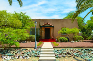 Who has time for running across town to access fabulous restaurants, shopping & UofA games?! You won’t need to with this mid-century CENTRAL home. Perfect for UofA Campus & Hospital Professionals, Students, Home Based Professionals (Yeah, it has a GUEST HOUSE!) or Families who covet being in Cragin, the “Opening Minds through the Arts Gold school” Elementary zone! The 40’s charm & character is oozing at every turn including built in cabinets, interior arches, lovely tile work and rich hard wood floors. Did we forget to mention the picturesque backyard - perfect for cool evenings & wine with friends (all tucked behind a private wall that gives a hug to your guests in the middle of Tucson)?!  So come, visit and fall in love!