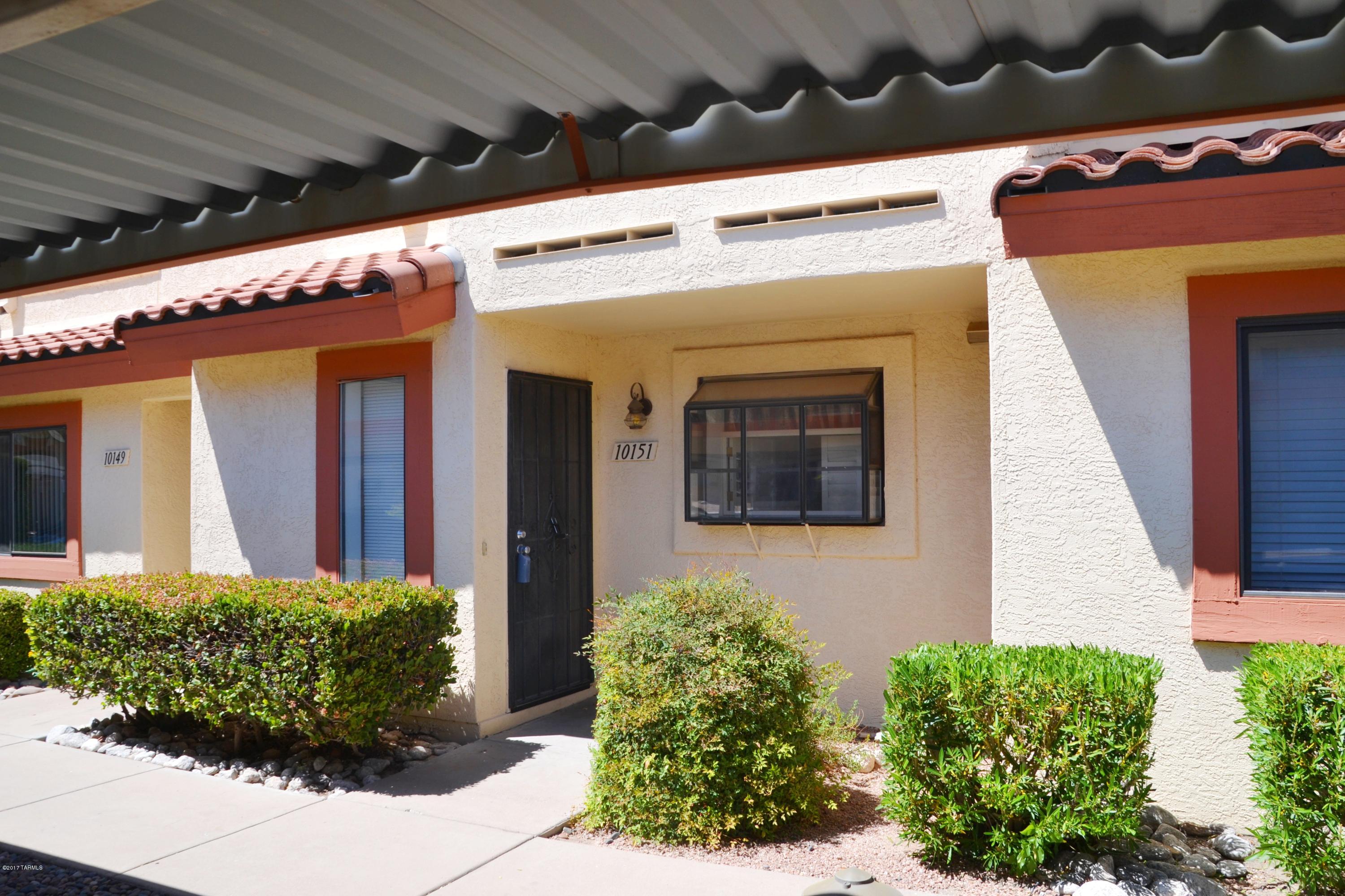 Desirable Eastside Location. Wonderful Townhouse, Open and Bright! Features 2nd floor Spacious Dual master suites, each with their own private balcony. Kitchen boasts an adorable pop-out window with a plantation shutter, and ample counter/cabinet space. Living room has built-in wet bar and sliding glass door that opens up to the covered patio and backs up to common area.  New window coverings, and newer HVAC. Surrounded by lush green trees, creating a sense of privacy.  Enjoy all the amenities the community has to offer including great surrounding area for walking! 2 Covered parking spaces right in front of unit!! FRESH PAINT AND NEW SINKS! A must see!