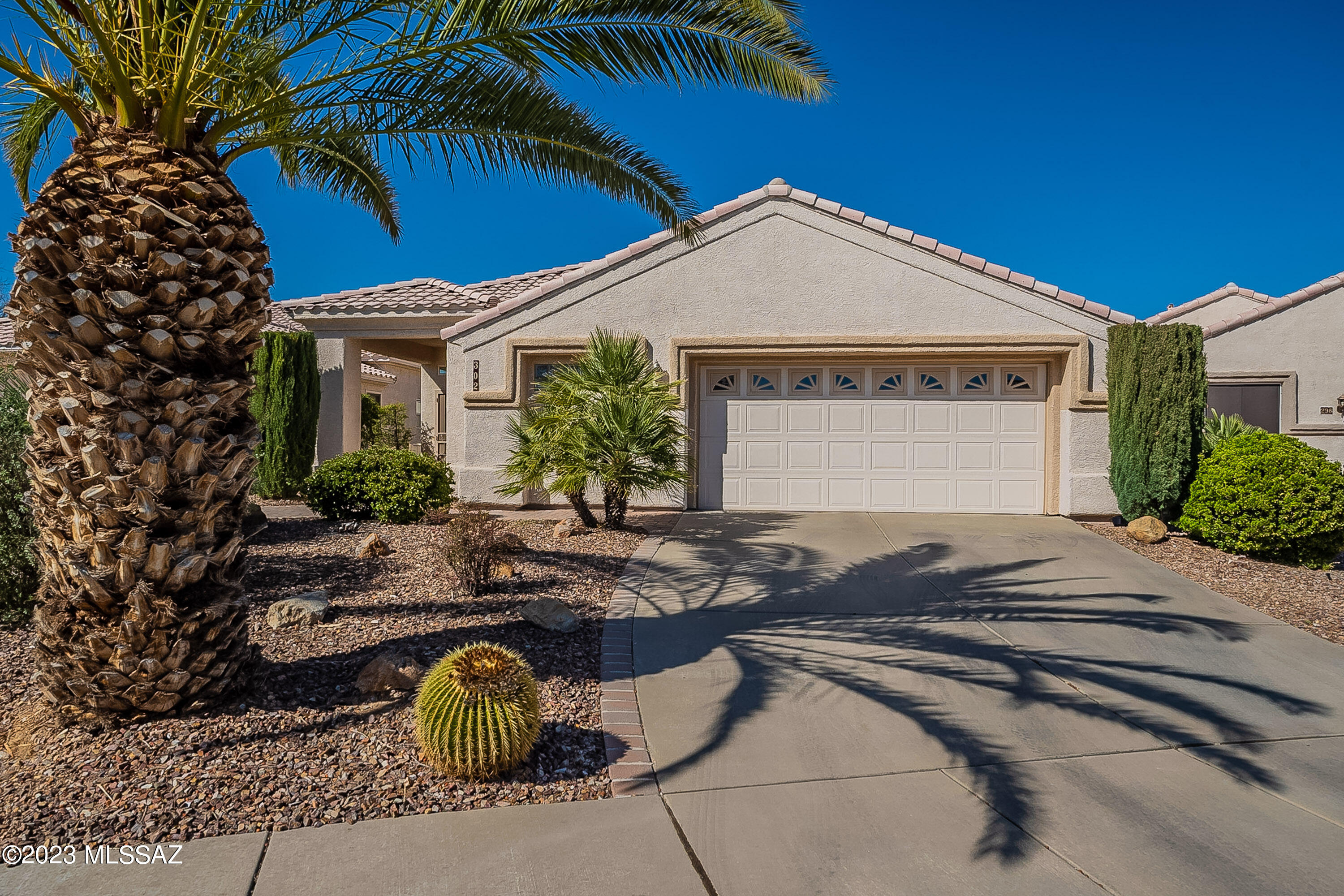 Welcome to this home located in the gated community of Sunrise Point Vistas with a large pineapple palm tree giving it delightful curb appeal!  Step inside to find an open living and dining room with 10' ceilings and ''tray'' design ceilings delivering an exquisite touch of modern day living.  All windows have been replaced with energy efficient Anderson windows and the clerestory windows provide natural light into the home.  Continue to the family room where you can gather around the gas fireplace or watch TV while preparing meals.  The kitchen features ample cabinetry, serving bar with pendant lighting, stainless appliances with gas range and bottom freezer fridge.  Your spacious master bedroom with ensuite bath has double bowl vanity and tile shower.  Step through the double doors to fi a built in office area to keep you organized and also a murphy bed that comes in handy when you have extra guests.   You are going to love the extra-large backyard with several sitting areas to choose from while you cook your favorite meal in the outdoor kitchen.  The oversized garage has two walls of cabinets and a work bench or use this space for your golf cart.  Come take a look and enjoy the wonderful Arizona retirement lifestyle!