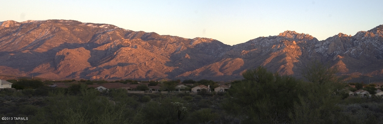 Simply breathtaking! Build your dream home in the exclusive neighborhood of Coyote Ridge, on a premium 2.73 acre lot at the end of a cul-de-sac. Very private, features spectacular Pusch Ridge views, you can even see the glimmer of city lights. Located in Oro Valley, with championship golf, international resorts, dining, shopping, hiking and biking all nearby, there's no better place to create your new home. All utilities at the lot line, flat building site, serene desert all around you. This is the place!