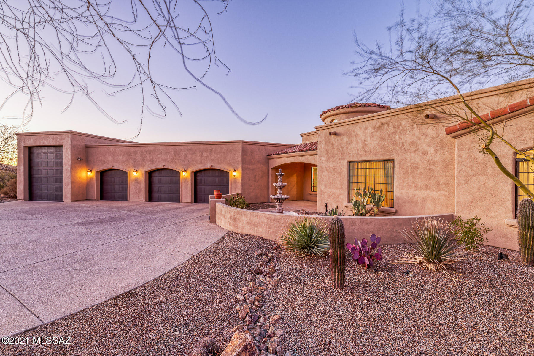 One of the best views in the area on this 3.3 acre Estate in all of Tucson Mountain Reserve. This 2009 custom built home has an abundance of outstanding features. The enchanting courtyard greets you and leads up to the custom iron front door. Once inside you will see an old world style meeting a new modern look that will not disappoint. In the chef inspired kitchen with granite counters, pull out shelves, knotty alder wood cabinets, 5 burner gas cook top stove, two islands and prep sink that will inspire you to create fine cuisine. The backyard calls for you to enjoy the resort-like setting with awe inspiring panoramic views, a custom pebble tech pool & spa with a waterfall & stone covered grotto You will enjoy many evenings by your outdoor fireplace accented with flagstone and Banco seating that adds to the luxury of the outdoor kitchen with built-in gas grill and refrigerator. The spacious master bedroom suite offers double sinks, jacuzzi tub, separate shower, and walk in closet. This expansive Estate is perfect for entertaining family and friends. In addition to the overwhelming beauty of this estate you will have plenty of room for toys and vehicles in your enlarged four car garage with workshop and storage room. Also boasting an attached RV garage with clean out, water, and 220 V outlet.
