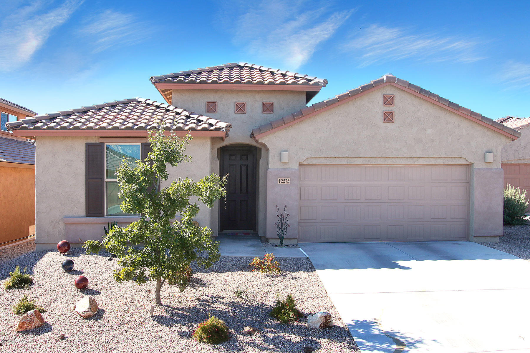 Seller will entertain offers between $310,000 and $320,000. Upgraded and detailed this home throughout. This 2,357 sq. ft; 3 br/2 ba home with a flex room and a great room opening to the kitchen offering: gourmet kitchen package with the latest and greatest - SS Kitchenaid appliances, Induction cook top, 3 ovens, refrigerator, granite counter tops, upgraded cabinets.  Offering tile floors throughout, window coverings, central vacuum, ceiling fans in all bedrooms, three dining areas: Dining, breakfast and island with bar stools (built-in bar and separate bench storage cabinets in dining area),  finished landscaping with rare cactus garden, timed drip irrigation front and back,  yard art (all included), 3-car tandem garage and spectacular mountain and desert views backing on common are