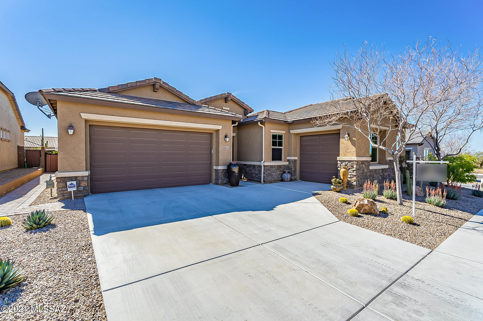 Enter through the gated, pavered court yard to a bright & open floor plan accented with 10ft ceilings, 8ft doors, up/down blinds & tile throughout. This split floorplan offers all 4 bedrooms with walk in closets & ceiling fans, 3 bathrooms & a converted 3rd car garage with handsink that can be a studio, workshop or workout room. A formal dining room & beautiful living room with a wall of windows open up to a kitchen with extended cabinets, granite counters, additional ice maker, SS appliances, gas cooktop & walk in pantry. In addition there is a mud room & laundry room with washer/dryer, cabinets and sink. Step out to the manicured backyard to enjoy grilling, hot tubbing or quiet time at the elevated seating area. A local park is around the corner with dog parks, play area & walking paths.