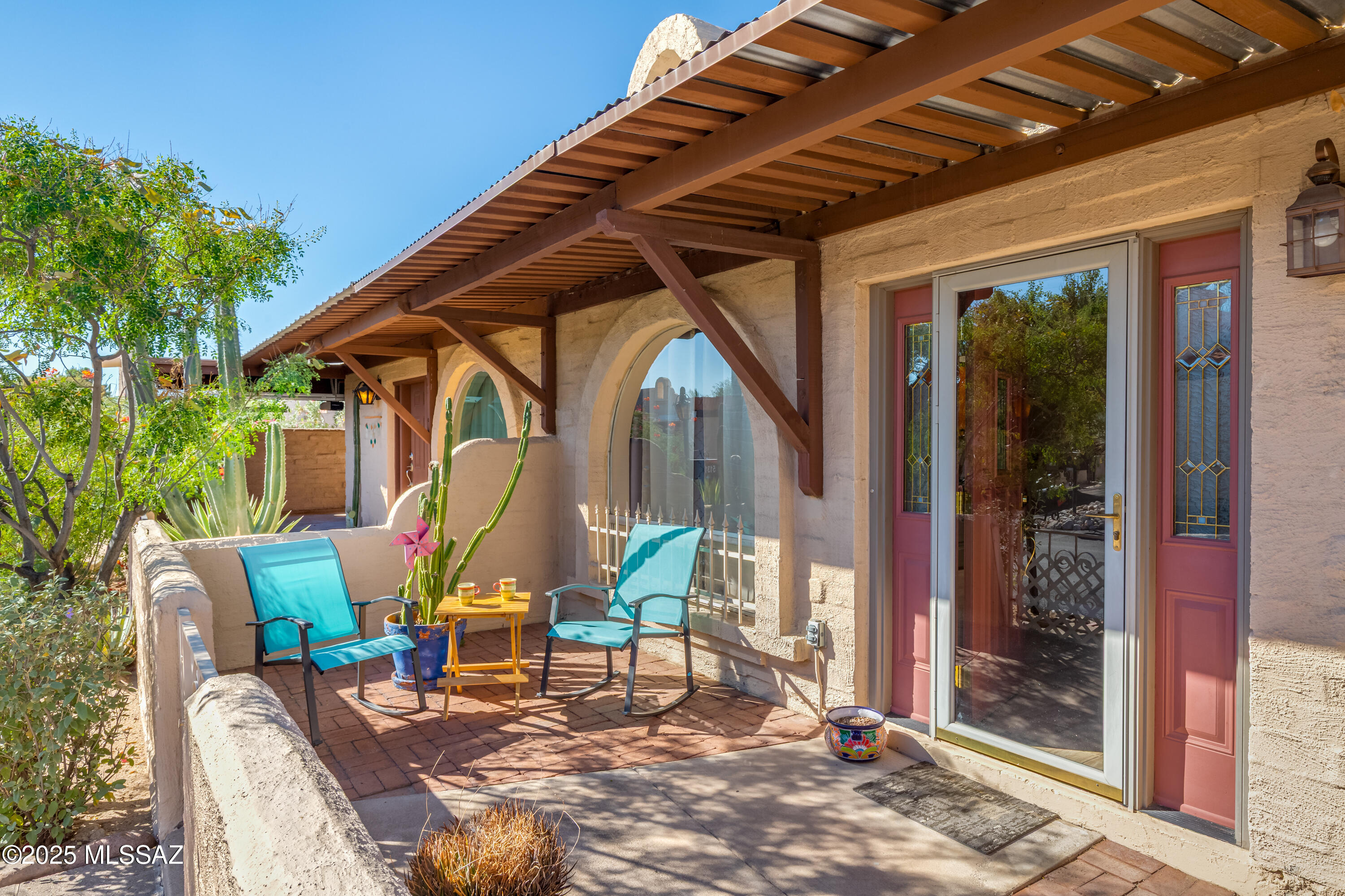 Tastefully updated Southwest Pueblo-style townhome in a desirable North-Central Tucson location near River and Oracle. Enjoy this 2 bed/2 bath home offering bright, open living with space with patio access from both the great room and primary suite. New HVAC system (2023), New Hot Water Tank (2025),  Dishwasher (2024), and newer washer & dryer.  The kitchen was remodeled in 2020 and the home includes 2 Pella sliders and a triple pane window in the 2nd bedroom. A cozy kiva-style fireplace adds warmth and beauty to the living space.  Skylights in both bathrooms let the light fill the space. Enjoy the Arizona lifestyle when you step outside to your private patio, where a covered seating area with soft lighting creates the perfect setting for morning coffee, evening dining, or simply relaxing year-round. Surrounded by vibrant flowering plants, this outdoor retreat is designed for the ultimate Community amenities include a pool, hot tub & clubhouse. Tucson's famous 137-mi Loop is right across the street.