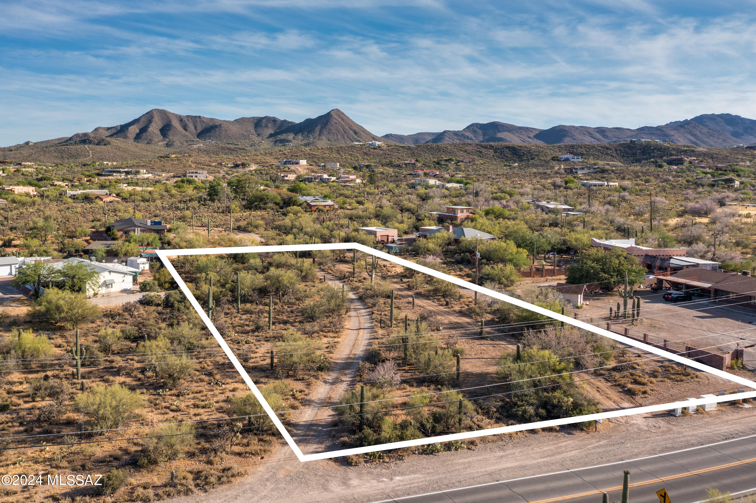 Beautiful 1.21 acre lot with gorgeous views of the Tucson  mountains. Nothing complicated about this lot! Shown on the plot map is a 2950 sq.ft. home with a 3 car garage. Look at all the room you have to build and grow on this beautiful lot. Easy to build with utilities at the street, no deed restrictions, many building sites and a desirable Westside location. Enjoy wildlife and the peaceful setting. Convenient location with quick access to I-10, several hiking trails, Pima Community College, downtown and parks. One seller is Licensed Realtor in the state of Arizona