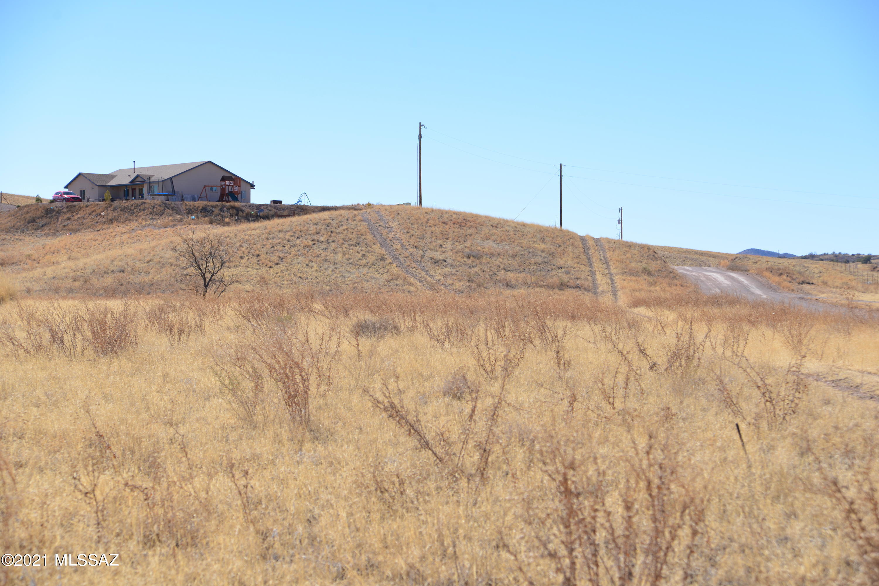 This is a very good value for a buildable lot in Sonoita Estates, ideal for a small scale home with good view opportunities to the West.  Some of this parcel is low, but there appears to be enough high ground available for a modest buildout.  The FHIS is in the Documents Section. The area's water table is good and a conventional septic system should work.  This is a quiet residential area with well kept homes, along with new construction.