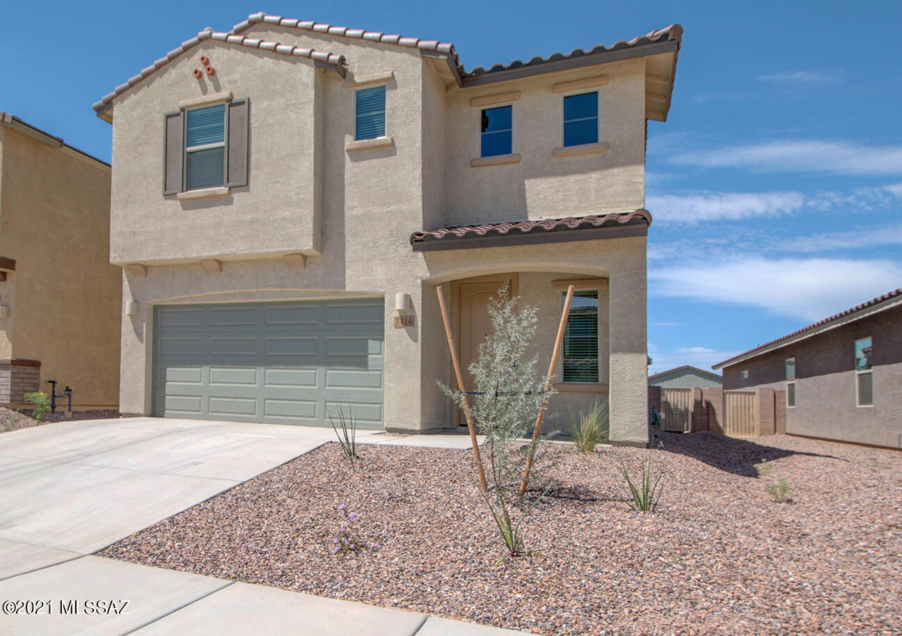 Located in the highly desirable La Estancia community this gorgeous & upgraded 4 bed 2.5 bath 2 story home (built by Meritage) is waiting for you to call it home! Main floor features a large great room with open kitchen & dining room. Upgraded kitchen features a large granite island, tile backsplash & SS appliances. Master bedroom on main floor. Upstairs is a cozy loft & 3 bedrooms.. Energy efficient washer/dryer convey! Covered patio with a low maintenance backyard has been landscaped with pavers and rock just waiting for your personal touch. The  La Estancia community has direct access to 'The Loop', as well as a community pool, basketball court and several beautiful parks. Conveniently located within close proximity to many major employers, including Davis-Monthan AFB, TIA, UA Tech Park, Raytheon and Amazon. Come see this gorgeous home today!
