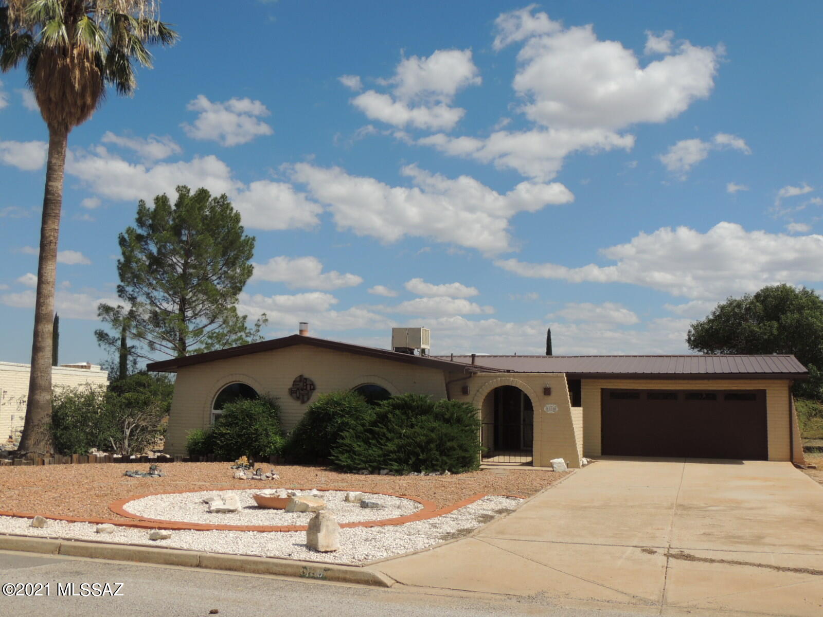 Very nice home with 2 BR/2BA in a great location! Nice view of the beautiful Cochise Stronghold. Large low care yard. Nice fireplace for those chilly evenings.  New metal roof,  water heater, stove and dryer installed in 2018. Updated lights and hardware, (knobs in kitchen, hallways and doors, etc.) Home is all electric and also plumbed for natural gas. Some furnishings staying. This home won't last long.