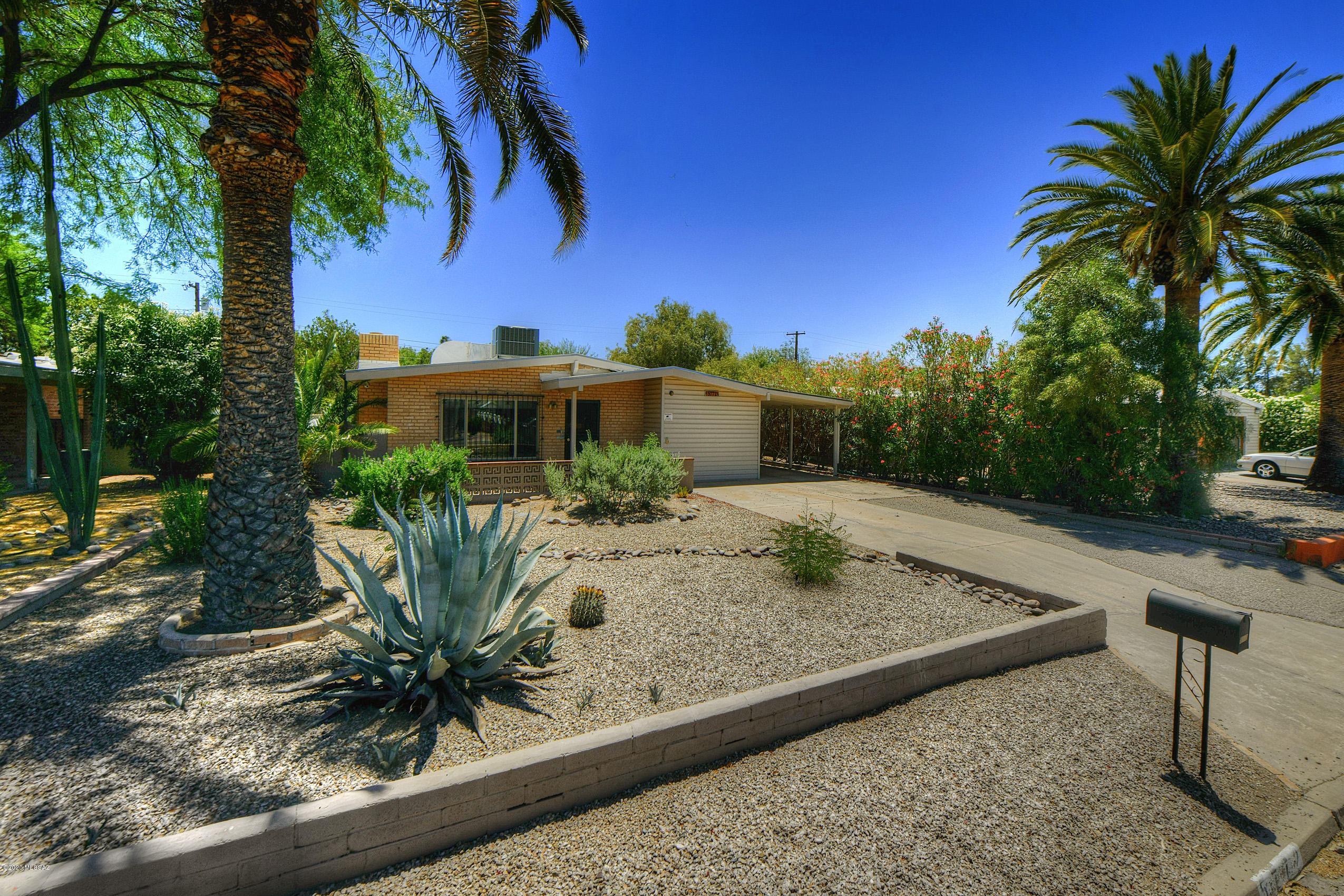Charming, bright and airy one-story brick home in convenient Central neighborhood. Very unique tile, wood trim with lots of character. Comfortable living room w/cozy gas fireplace & lovely dining rm. Fully remodeled kitchen. Both bedrooms open to large  AZ room at back of home. Large office/den can be walled off for private room. New heat pump/AC and roof replaced in 2013.  Large yard with brick patio and gazebo-enclosed hot tub.