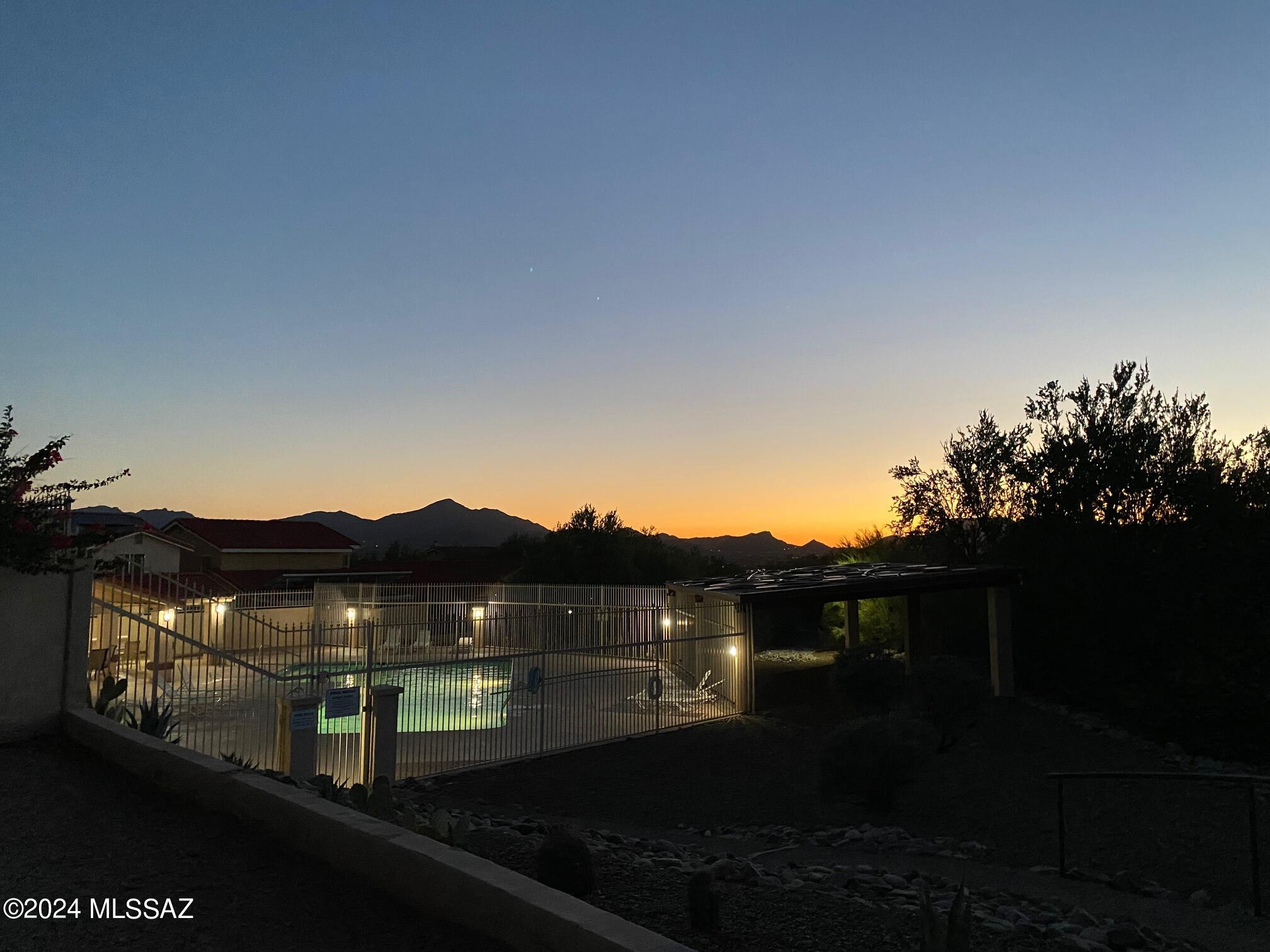 Easy, spacious floorplan make the square footage feel bigger than it is.   Newer appliances, ceiling fans, paint and carpet. Bathrooms have been updated. Third bedroom is used as a den with split plan for the guest bedroom/bath.  Tons of hall storage!! Covered porch in private raised elevation backyard. Endless views of Tucson Mountains. Nice northwest neighborhood with community pool and walking trail. Close to schools and shopping.  Up to three pets considered with $30 monthly rental increase each.  Great for families. Easy access to I-10.