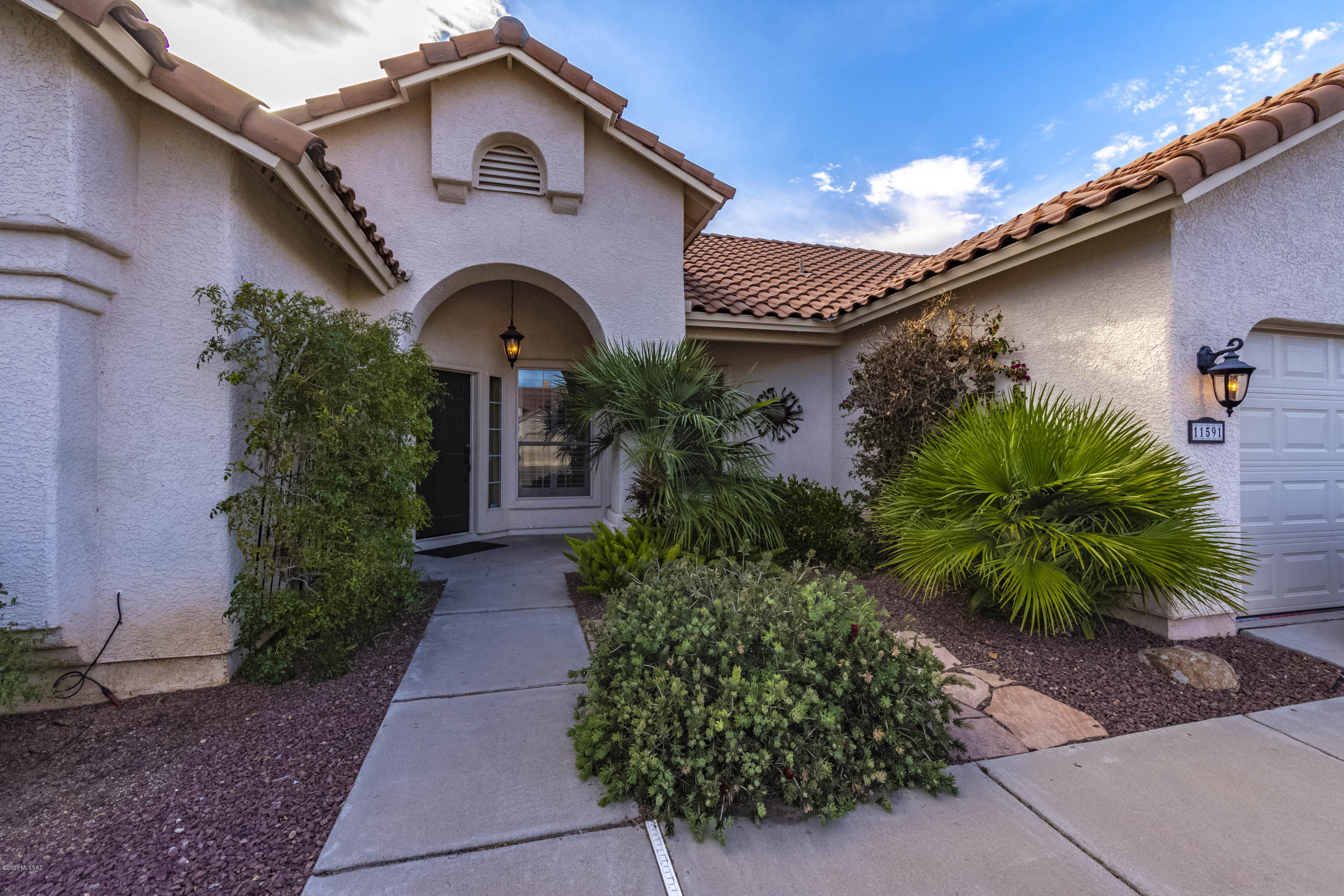 Gorgeous 3 bed + Den 2 bath home in the highly sought after Copper Creek Oro Valley Community. Everything is updated in this one! Wood floors, updated bathrooms, granite counters, stainless appliances, custom shutters, large private corner lot, lush landscaping with plant filled trellis's, sparkling pebble tec pool.... the list can go on and on. This one is a show stopper.