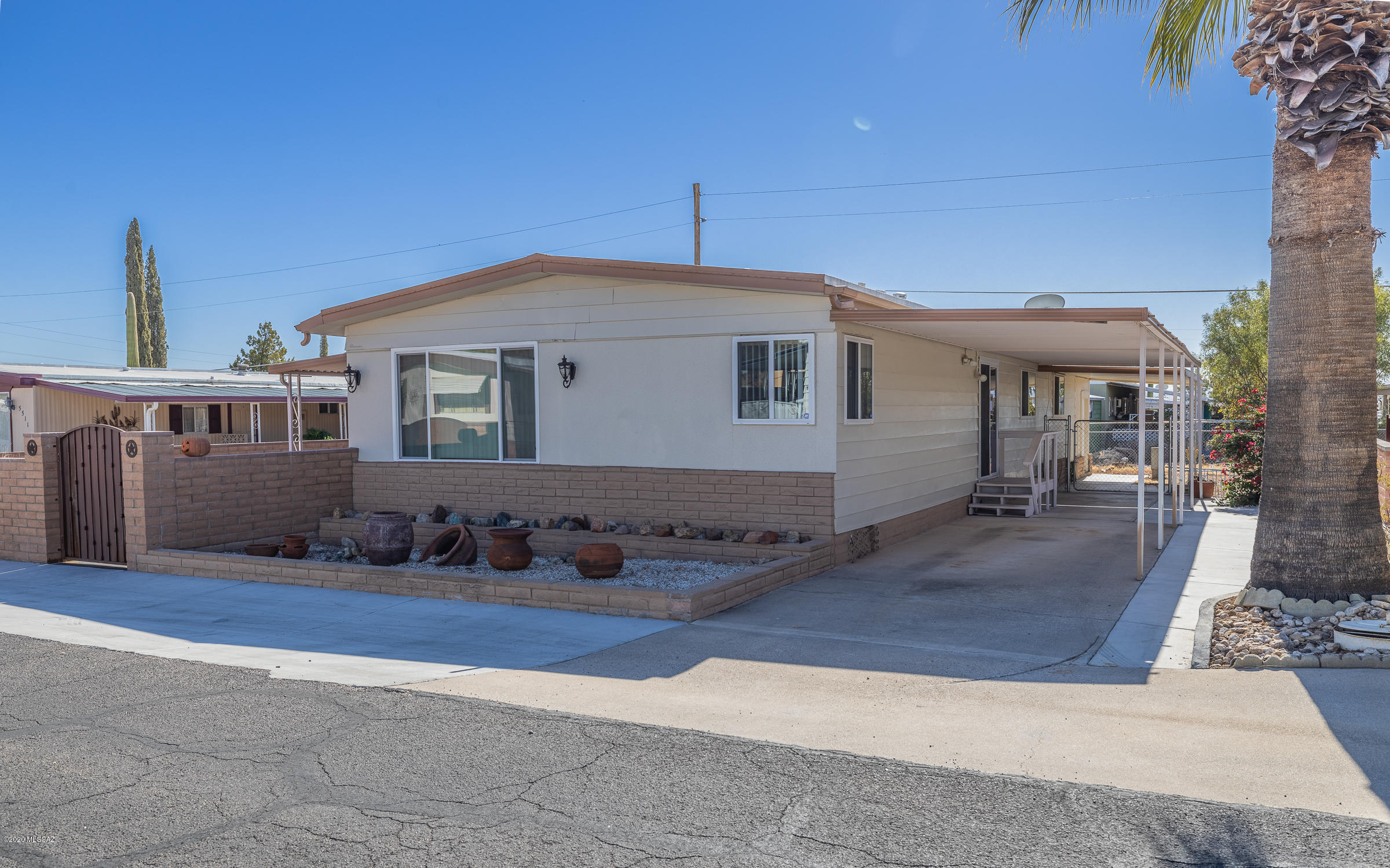 Fantastic Mountain Views!! This home has much to offer.  Entertainment sized living room, Beautiful remodeled bathrooms with travertine tile. Open kitchen leading into dining area.  Lovely covered patio for your enjoyment.  This home has country atmosphere with close-to town convenience. Freshly painted interior and exterior.  Enjoy the TUCSON ESTATES Adult Community with exercise facilities, 2 large swimming pools, free golf, tennis. Large rec centers and so much more.  Come and see!!  PLEASE WEAR A MASK AT ALL TIMES WHILE ON THE PROPERTY AND IN THE HOME.
