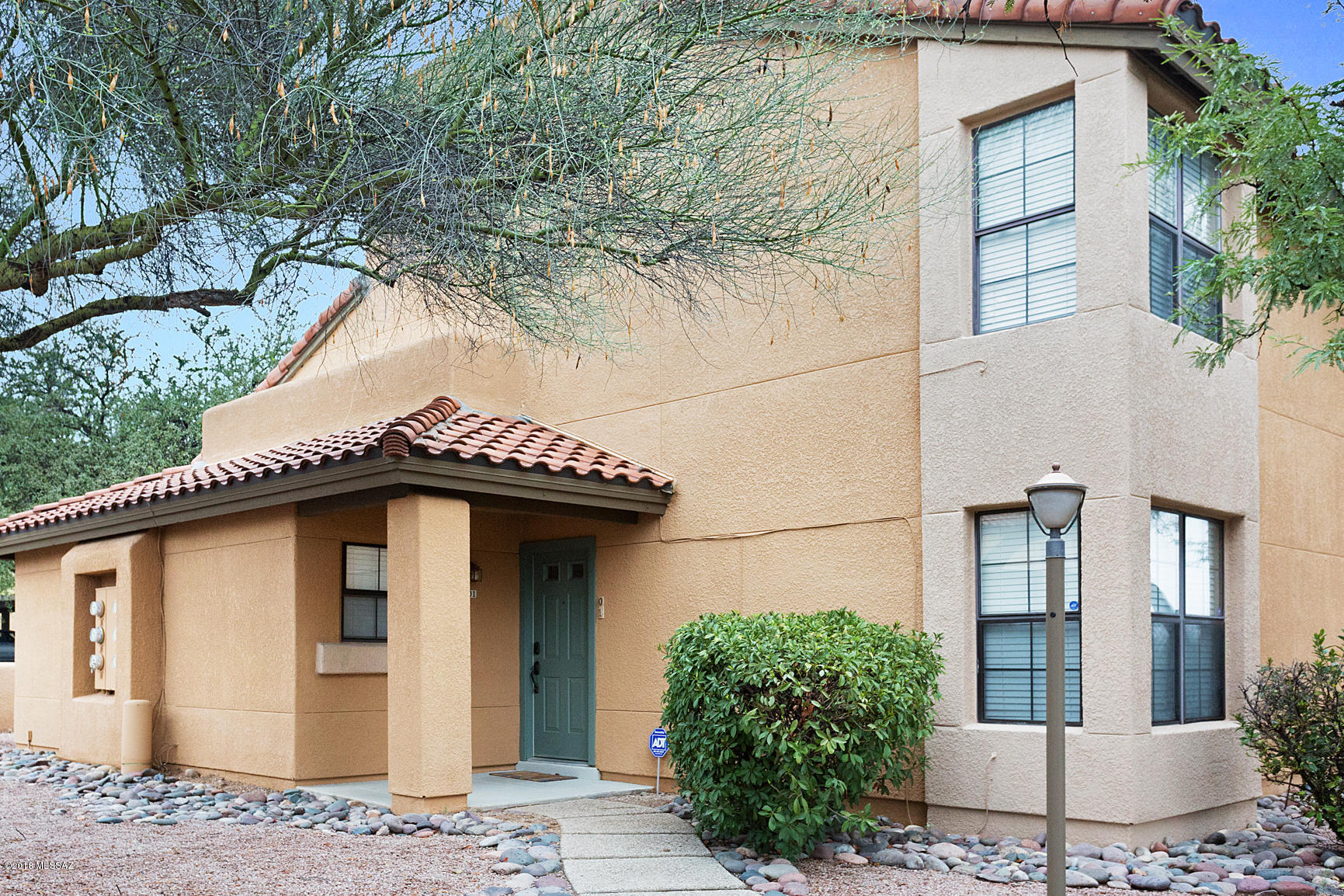 Fabulous 2 story condo w/bedroom & bath on the main floor and bedroom & bath on upper floor.  Gorgeous tile floors thru-out.  Open kitchen wi/granite countertops & all appliances. Stunning vaulted great room area w/fireplace.  Such ambiance!  Amazing views of Catalinas & city lights.  Walk-in closets.  Storage closet on cov'd patio & 1 cov'd parking space.  Brand new HVAC system!! 
 Walking convenience to La Encantada with shopping, restaurants, cocktails and galleries so close.  Such a dream. Beautiful window placement w/lots of natural light. Full time or vacation home, this is perfect.  HOA fee includes fire, trash, exterior pest & termite, common area insurance, grounds, pool/spa, tennis court & recreation center, sewer lines, streets & parking, building exterior, roof & patio wall.
