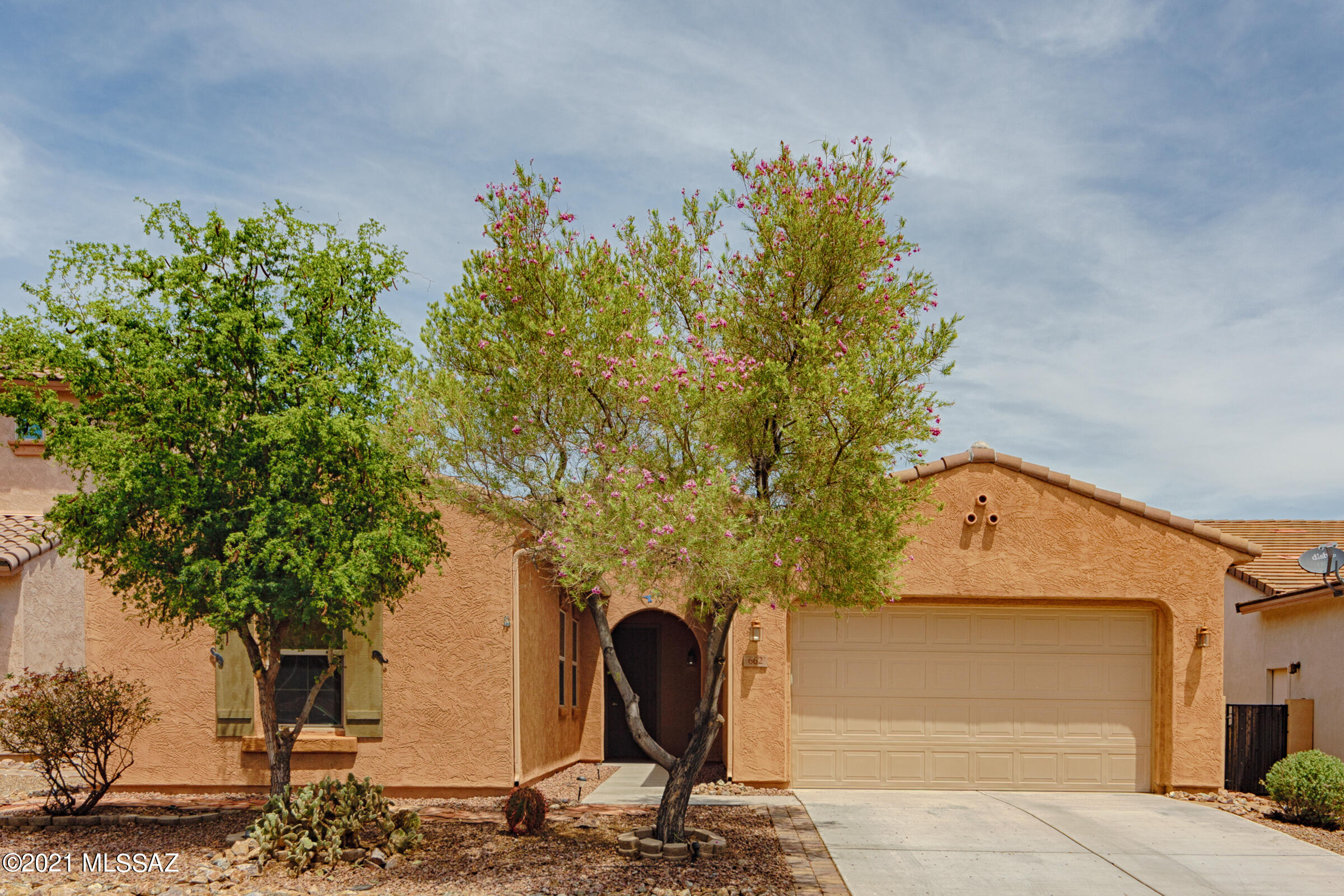 Popular Meritage split floor plan ranch style located in the gated Entrada Bonita subdivision. Open kitchen with all appliance remaining. Granite counters and cook's island/breakfast bar. Four burner gas range. 42'' cabinets and walk-in pantry.  Master suite has private entry to laundry from the large walk-in closet. Master bath has double vanity, separate shower and soaking tub. Laundry is plumbed for gas and electric. Great room features theater style projection system. Main hall has two additional bedrooms each with large closets.
Fresh paint throughout. Rear yard has water feature, covered patio, garden and turf areas. Property backs to wash; no rear neighbors. Three car garage. Walking distance with neighborhood entry to Anza Trail school.  Close to parks, pools, main club house.