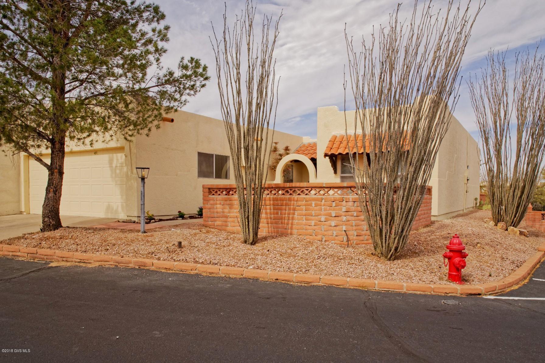 MUST SEE!! Remodeled Townhouse with great mountain views. You will love the new kitchen, tile floors, updated bathrooms, new paint inside and out, updated electric and a new roof. It has a private back yard with covered patio that backs up to open space. The front sitting area has great views of the mountains.