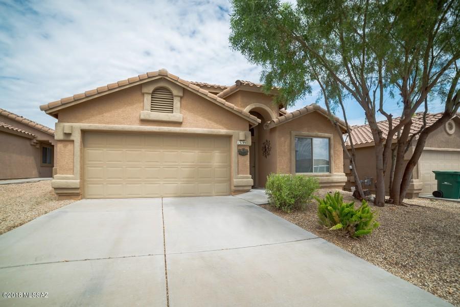 If the stunning mountain views weren't enough, this 4 bedroom,2 bath home is move-in ready and offers solar power! This home features two living areas, a formal dining area and a spacious kitchen with an island for additional counter space, Vaulted ceilings, a gas range, ceramic tile and carpeted flooring. The spacious inside and covered patio make it great for entertaining inside and outside. Vail Schools District, Close to Schools, I-10, Shopping, Raytheon & Davis Monthan.