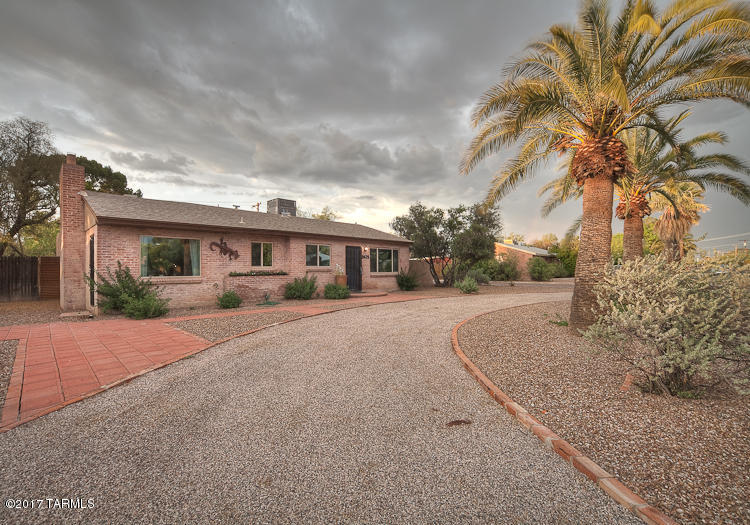 Range Priced~Seller will accept of counter offers between $279,900-$289,900.THE PERFECT COMBO OF MODERN & VINTAGE. U of A area home in highly sought after La Madera subdivision. 3 bedroom 2.25 bath with gorgeous NEW kitchen and Beautiful permitted MASTER SUITE addition. GRANTE & Stainless Appliances. New fixures, Baths  and newer HVAC.Handsome sealed concrete floors, and new wood-laminate flooring, living room with fireplace,All New windows and sliding doors. Huge lot, private walled backyard, Rolling security gate to your 2 car Carport. Backyard is Huge w/ custom metal patios & pavers . Built in BBQ , Separate Workshop & storage . This home is in pristine condition, MUST SEE!!