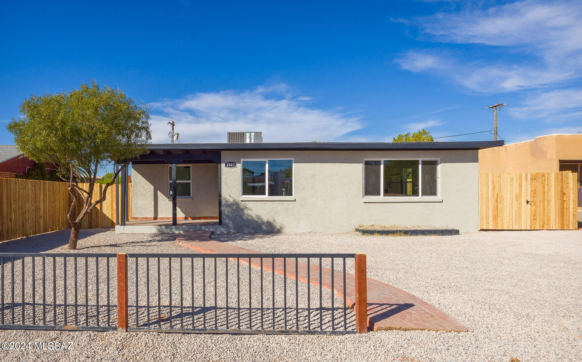 Beautiful home with a separate guest house close from UofA. The main house, at 1,650 sq ft, features 3 bedrooms and 2 baths, with an open-concept living space that flows into a modern kitchen, ideal for family living and entertaining. The master suite offers a private retreat with an en-suite bath, and split floor plan.
The 760 sq ft guest house provides 2 bedrooms, 2 baths, and a complete kitchen and living area, perfect for extended family or rental income. With two carports and ample outdoor space.
2 Carport-Garage w/electricity inside.
NEW AC,WINDOWS, WATER HEATERS AND ROOFS
Close to UofA, Banner, golf courses, Biking trails, shopping, dining in downtown Tucson. Live in one and generate income from the other.