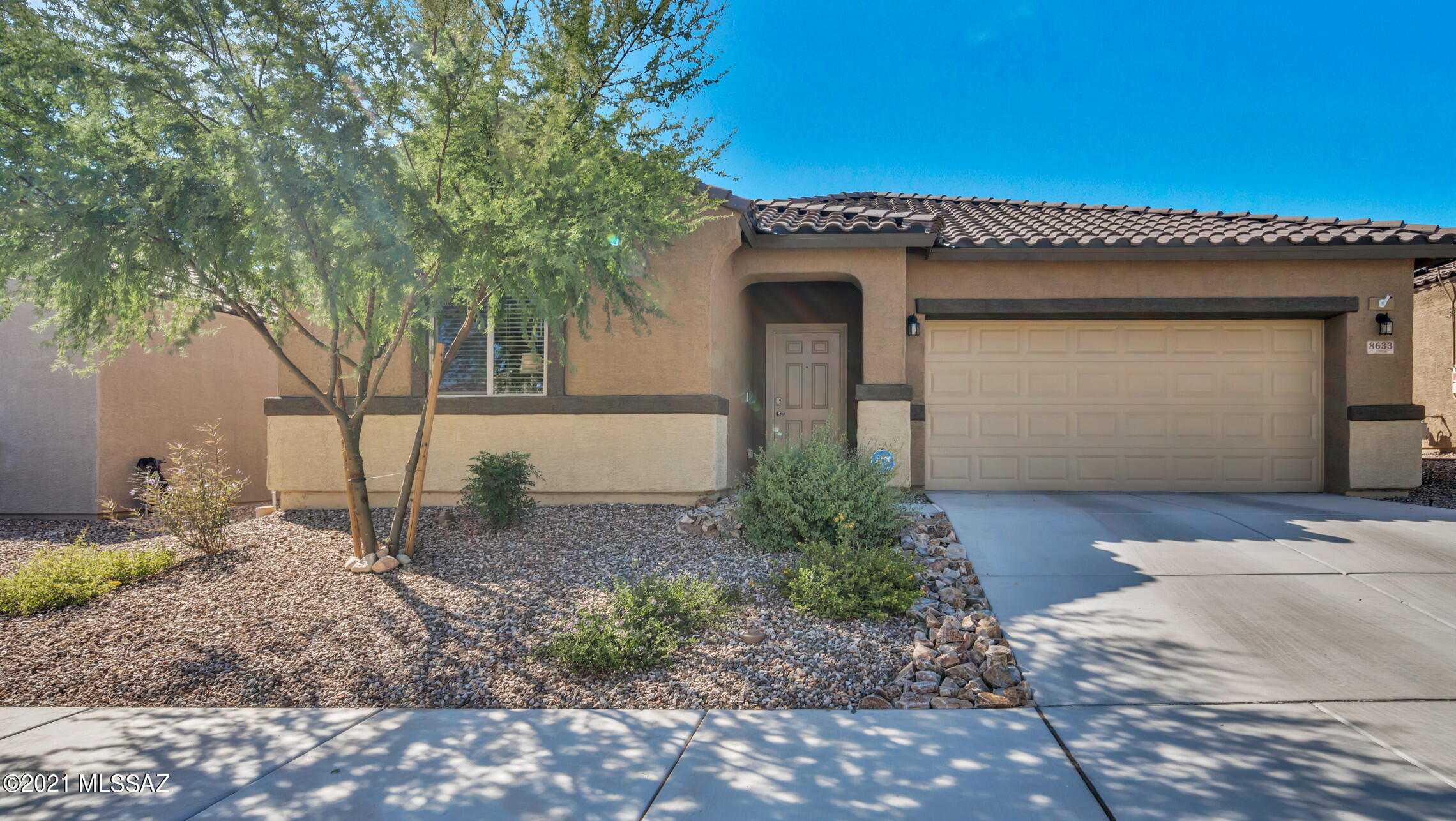 Located in a convenient, destination neighborhood, this delightful home offers fabulous desert, mountain and sunset views. The home's split floor plan features 3 bedrooms, den (currently used as a library), formal dining room (currently used as an office) and kitchen with breakfast bar and adjoining casual dining area and great room. The kitchen boasts 42'' dark cabinetry with color coordinated granite countertops and stainless steel appliances (gas range). The kitchen sink includes a reverse osmosis system for drinking water. The ample (21' x 14') Primary Bedroom Suite includes a large walk-in closet and the ensuite bathroom has double sinks. Flooring in all public areas is 20'' square neutral tile and is coordinated with 2-tone custom decorator neutral paint colors. There are 5 overhead fans. The beautiful views are enjoyed from the covered back patio (with retractable patio shades) and the professionally landscaped backyard -- view fencing, pathways, plantings and turf. This Energy Efficient home features a a whole house water softener and a tankless hot water heater. It is ENERGY STAR Qualified with HERS Rating, Bath Exhaust Out, ENERGY STAR Appliances/Light Package/Windows, as well as Low Flow Faucet & Showerheads. This gently lived in home is better than new !