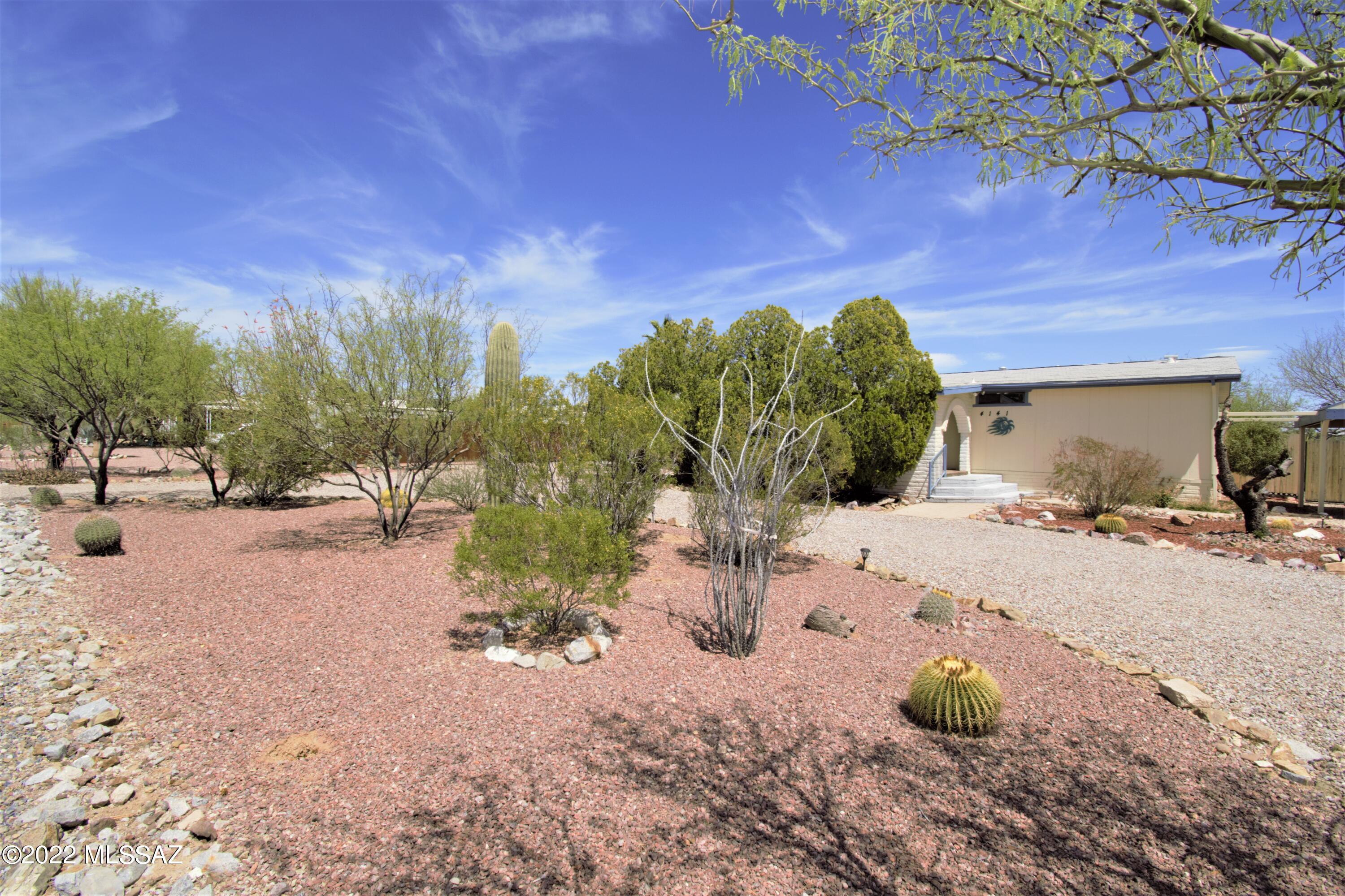 Come see this beautifully updated home in Tierra Linda. The home has recently been remodeled with granite counters, new vinyl flooring throughout and newer paint and appliances. Located on a peaceful paved street with some mountain views, and a private back yard. Dual patios on East and West sides add extra shade and privacy for relaxing and entertaining. A firepit and fully landscaped yard welcome you into your new desert oasis! Two car ports allow for covered parking in front of home. The HVAC system was completely replaced with new AC and Gas furnace in 2021. This home will not last long, and is stunning!
