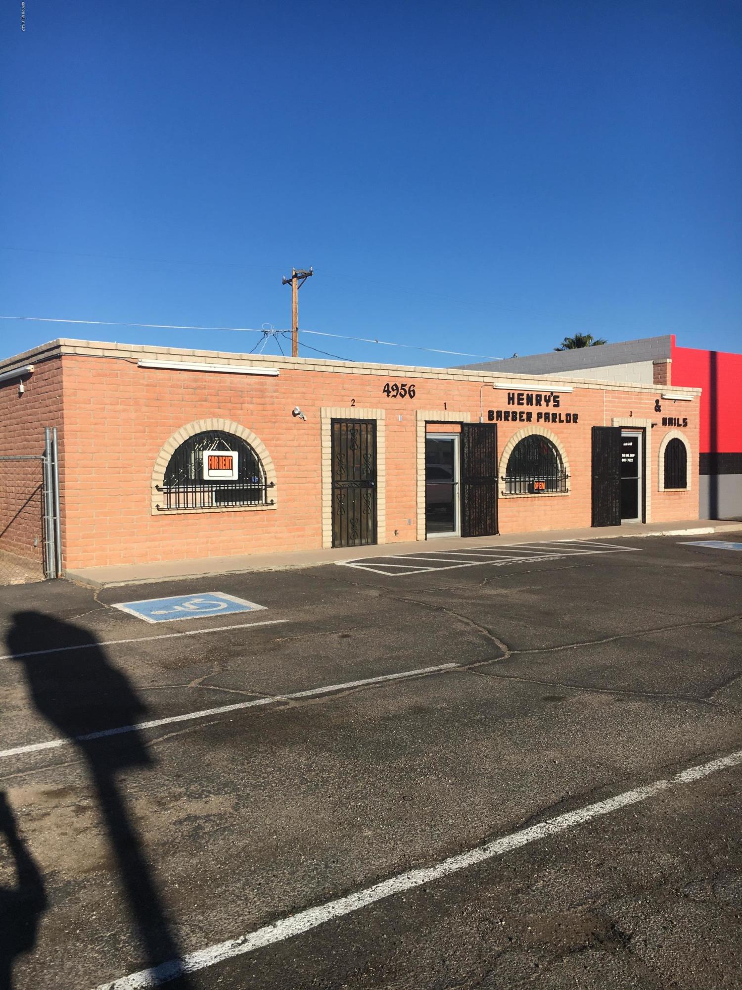 Well Establish Henry's Barber Shop on S. 12th ave. includes 3 chairs and sinks, other unit for office space and one is nail salon. Building is 2000SF could be turn into one. 2 other parcels included in sale also 65x140 ea both fenced. Zoned C2, paved parking lot.