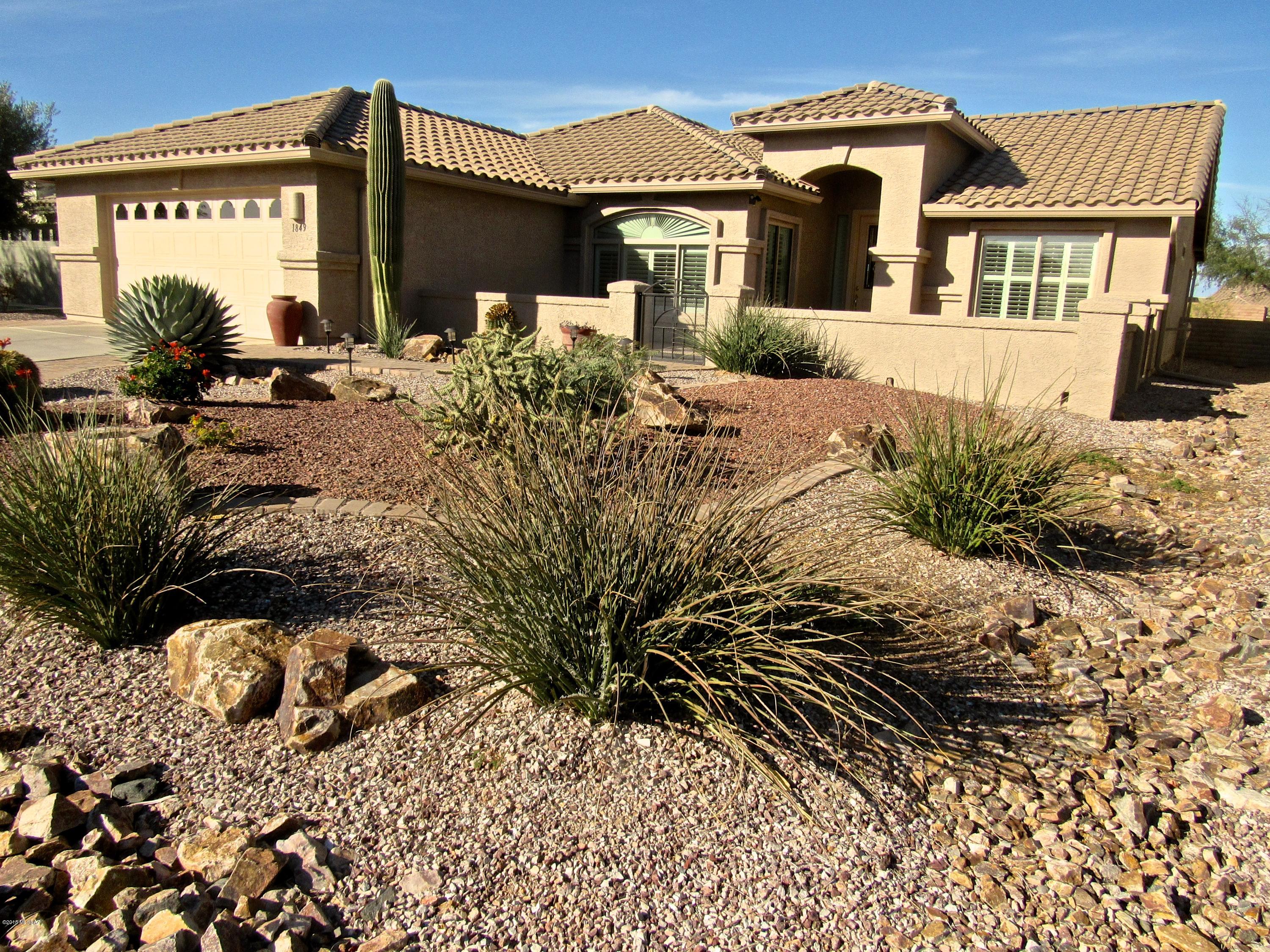 You are welcomed to this expanded Laredo through the open front court yard.  Home boasts 1,963 square feet, two bedrooms, two bathrooms, den, eat-in kitchen, FP in the great room, laundry, and 2-car garage.  This immaculate home is move-in ready and features neutral walls, tile, and carpeting throughout. The master suite features a vaulted ceiling, and the bath has dual sinks plus an oversized walk-in closet.  The nicely landscaped rear yard has a spacious covered patio--perfect for hosting a large gathering of family or friends, yet cozy enough for intimate entertaining.
