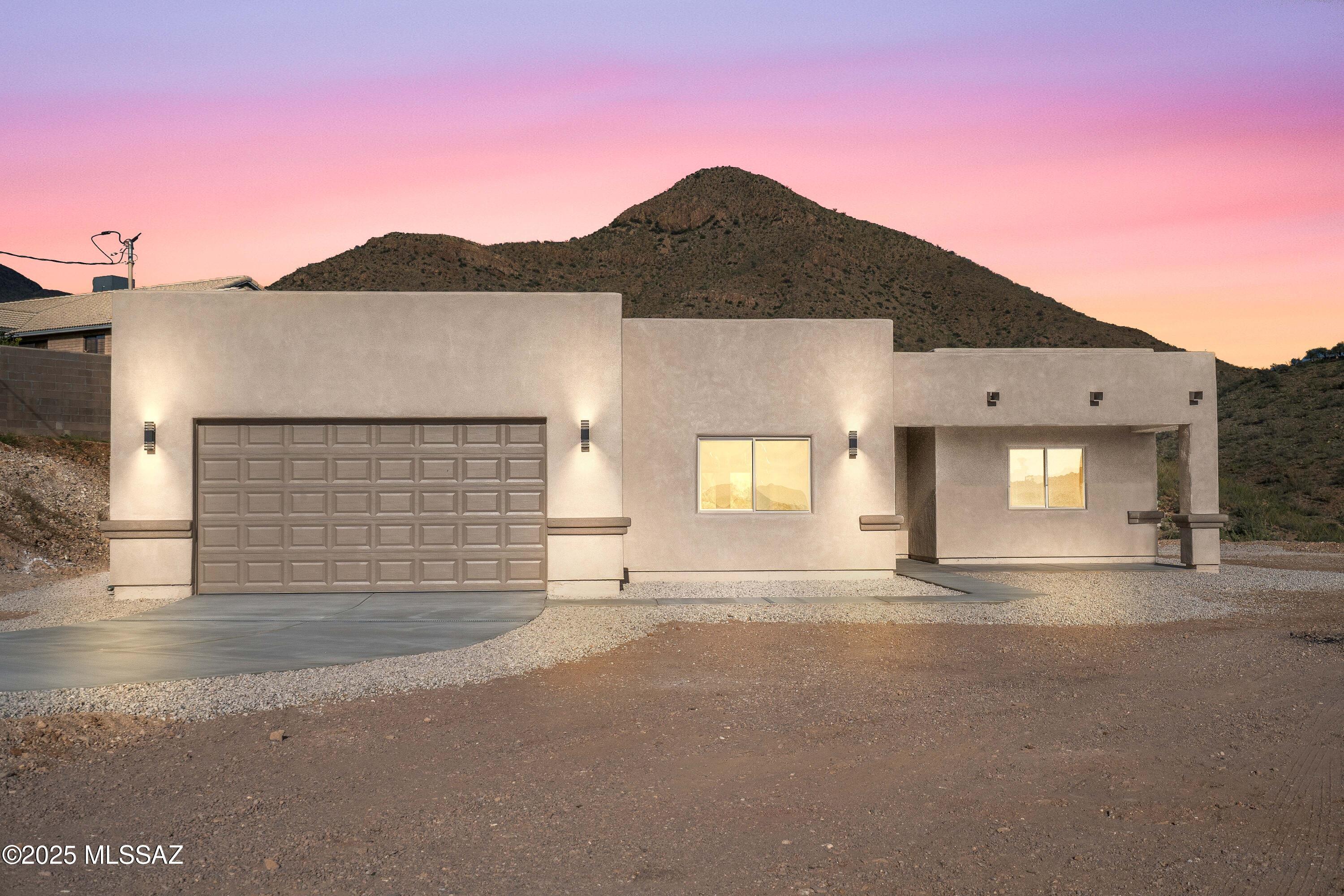 Experience modern Santa Fe-style living in this newly constructed 1,897 sq ft home, perfectly positioned on the side of a hill to capture truly unobstructed panoramic views.
This thoughtfully designed 3-bedroom, 2-bath residence blends timeless Southwest charm with contemporary finishes. Step inside to find an open, light-filled floor plan accented by elegant ceramic tile throughout. The stunning kitchen serves as the heart of the home, featuring quality cabinetry, sleek countertops, and a layout ideal for both everyday living and entertaining. The spacious primary suite offers comfort and privacy, while the additional bedrooms provide flexibility for family or guests.