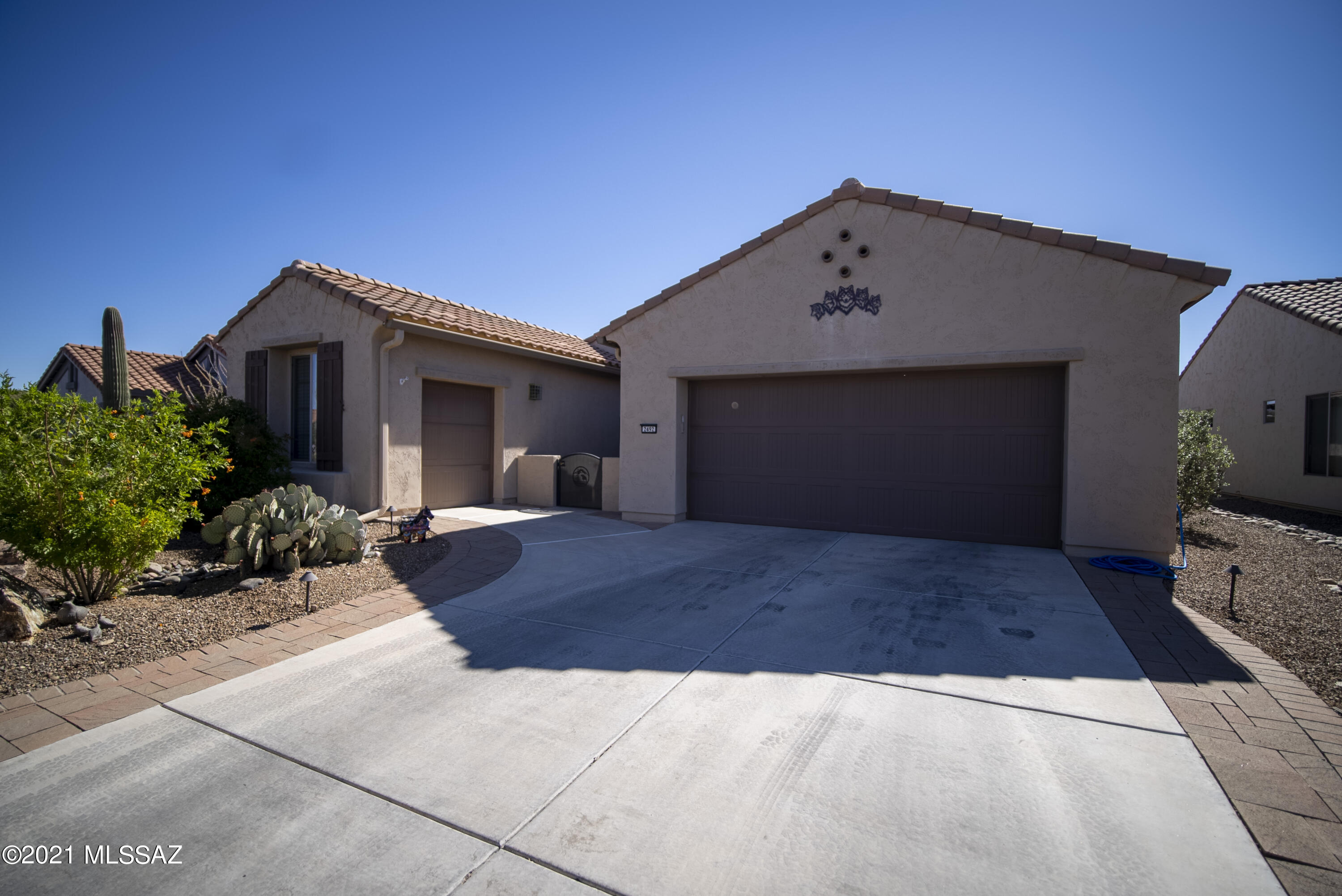 This gently used beauty is a sight to behold!  Built in 2010 it has been primarily on a winter only basis.  It is built the way you want to live and entertain with a great room and split bedroom floor plan.  Enter through the courtyard and step into a foyer with a striking in-laid round tile piece. The great room has an inset gas fireplace with a glass tile surround & wood mantle that is perfect for taking the chill off during a cold spell.  Gentle, warm colors highlight the architectural features of the home.  It backs to a lush wash area that provides privacy. Large covered patio provides cover from the sun and there is a water feature.  The home is being sold partially furnished per the Furnishings Inventory List under documents.