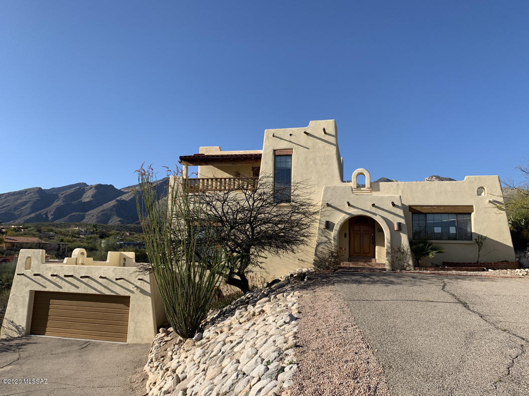 Cimarron Foothills Estate custom home sits on nearly an acre and a half of hillside property! * Amazing panoramic city and mountain views * Spacious great room features exposed wood beam ceilings, wood burning beehive fireplace, designated dining area, saltillo tile & concrete flooring & a wet bar * Master suite is up a level with own balcony and mountain views * 2 other spacious bedrooms with a full guest/hall bathroom * Kitchen features island with cooktop, stainless wall oven & dishwasher, breakfast nook & Mexican style tiles * Small pool in backyard is covered and not included in value of home * Listed nearly $100K under last listing in 2019 * Great location and value! * Home may qualify for seller financing (VA Vendee) see attached flyer for more information
