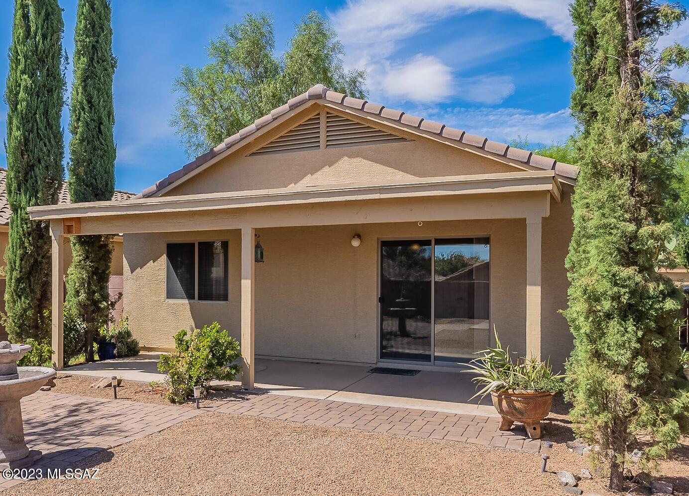 Great starter home for first time buyers. Well-maintained, move-in ready! Distinctive Travertine tile is laid in a mosaic pattern in all but the two bedrooms. Large, eat-in kitchen displays glistening granite counters set against oak cabinets and black appliances. Both full bathrooms feature executive height vanities. The east-facing covered patio is shaded most of the day to enjoy outdoor living. A high wall encloses the fully landscaped yard, protects children and pets and provides privacy. There's easy, immediate access to several shopping centers and Interstate 19.
